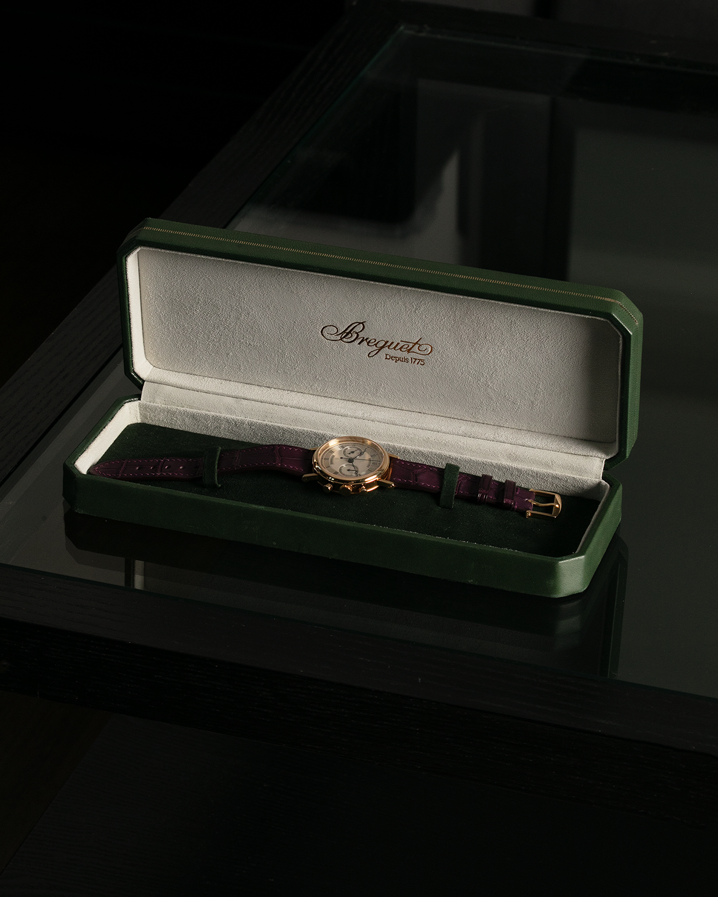 Brand: Breguet Year: 1990’s Model: Classique Chronograph Reference Number: 3237 Material: 18-carat Yellow Gold Movement: Lemania Cal. 2310, Manual-Winding Case Diameter: 36mm Lug Width: 18mm Strap: Unbranded Dark Purple Alligator Leather Strap with Signed 18-carat Yellow Gold Breguet Tang Buckle