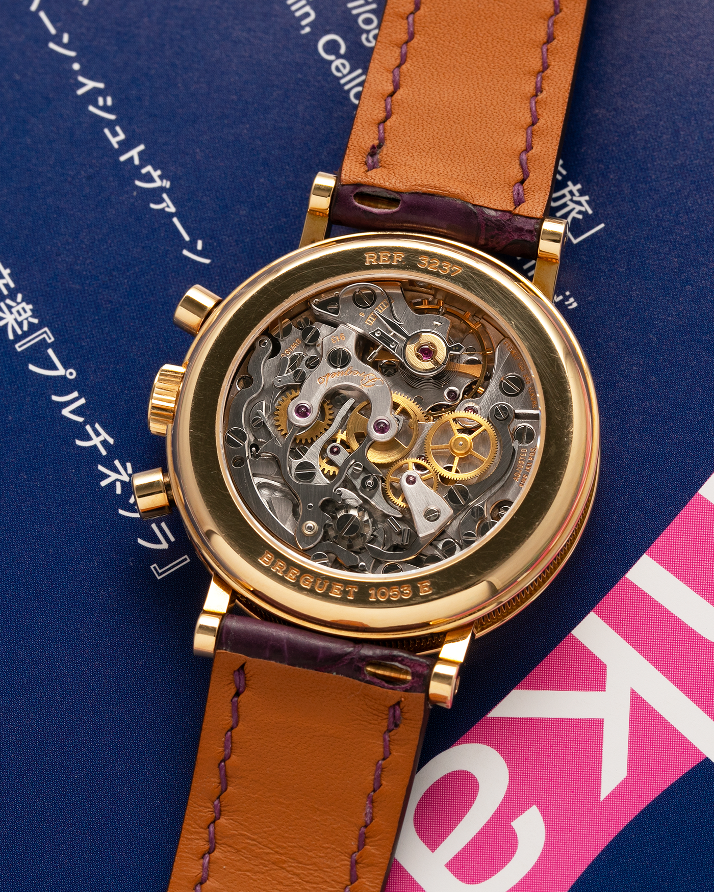 Brand: Breguet Year: 1990’s Model: Classique Chronograph Reference Number: 3237 Material: 18-carat Yellow Gold Movement: Lemania Cal. 2310, Manual-Winding Case Diameter: 36mm Lug Width: 18mm Strap: Unbranded Dark Purple Alligator Leather Strap with Signed 18-carat Yellow Gold Breguet Tang Buckle
