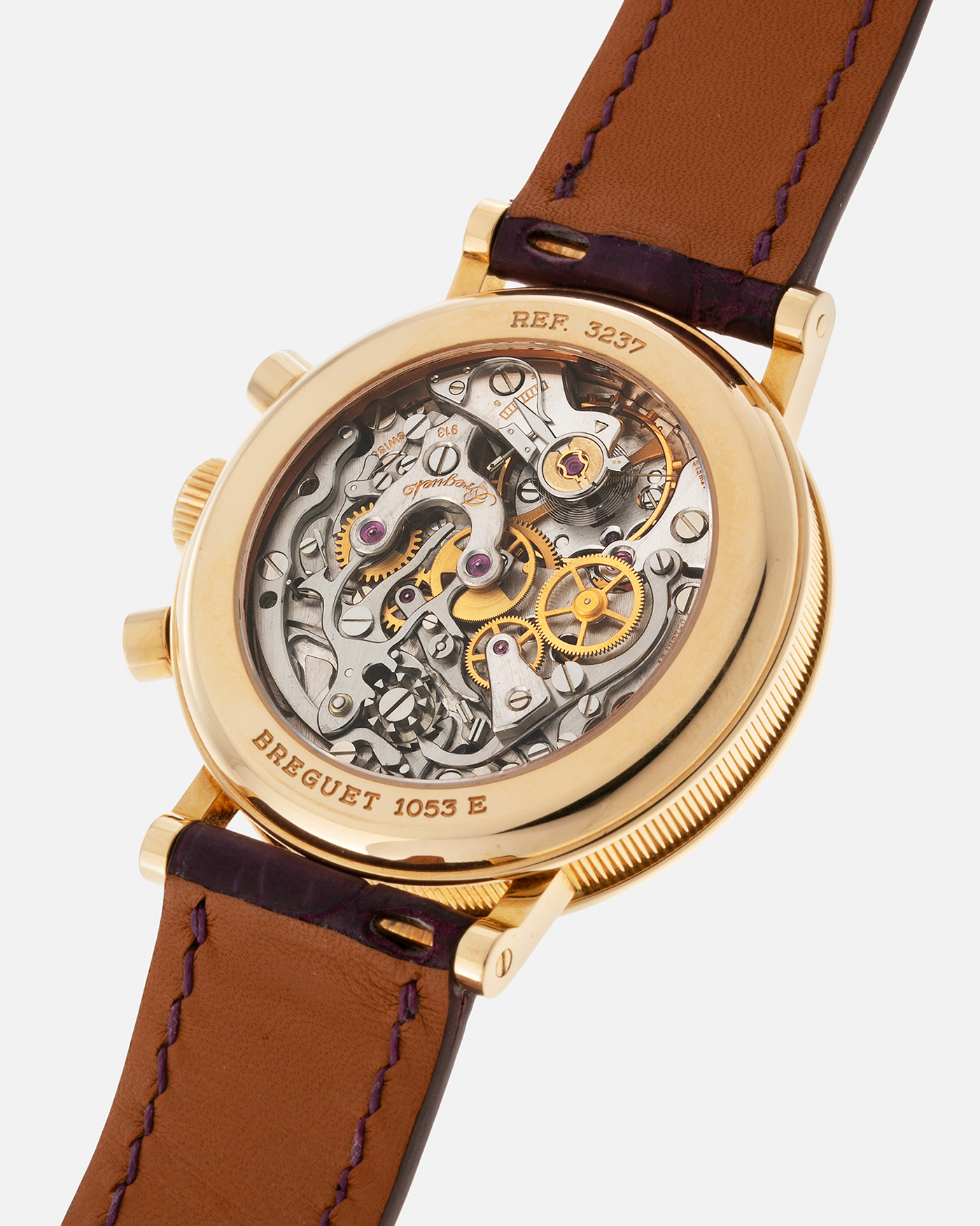 Brand: Breguet Year: 1990’s Model: Classique Chronograph Reference Number: 3237 Material: 18-carat Yellow Gold Movement: Lemania Cal. 2310, Manual-Winding Case Diameter: 36mm Lug Width: 18mm Strap: Unbranded Dark Purple Alligator Leather Strap with Signed 18-carat Yellow Gold Breguet Tang Buckle