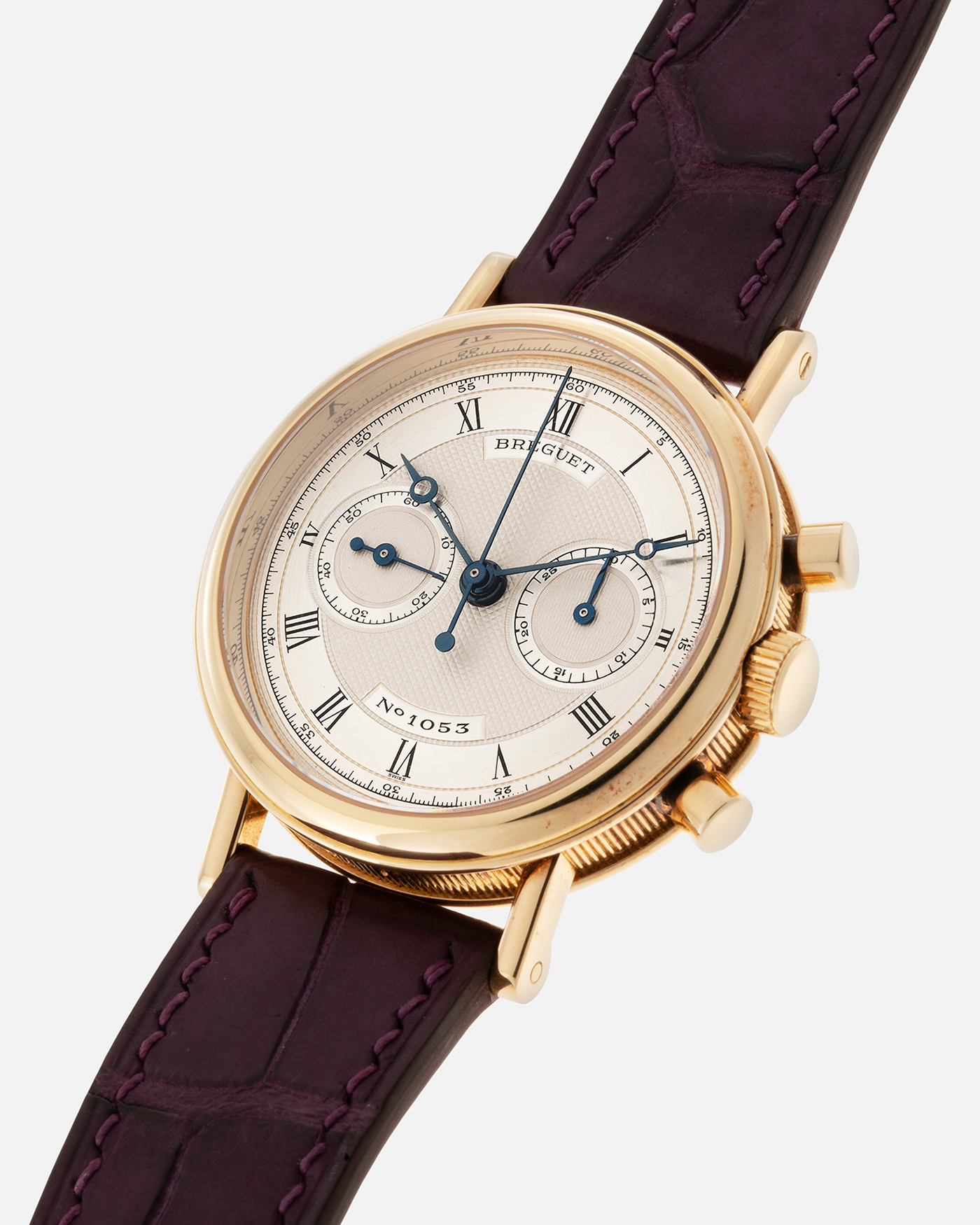 Brand: Breguet Year: 1990’s Model: Classique Chronograph Reference Number: 3237 Material: 18-carat Yellow Gold Movement: Lemania Cal. 2310, Manual-Winding Case Diameter: 36mm Lug Width: 18mm Strap: Unbranded Dark Purple Alligator Leather Strap with Signed 18-carat Yellow Gold Breguet Tang Buckle
