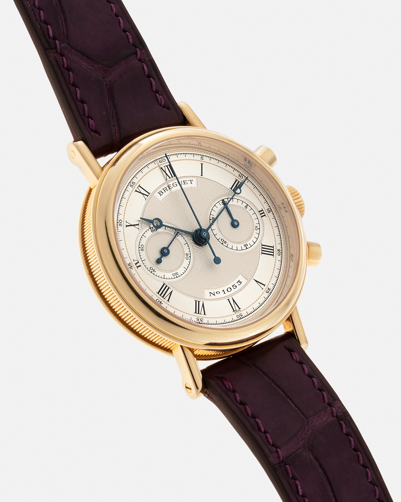 Brand: Breguet Year: 1990’s Model: Classique Chronograph Reference Number: 3237 Material: 18-carat Yellow Gold Movement: Lemania Cal. 2310, Manual-Winding Case Diameter: 36mm Lug Width: 18mm Strap: Unbranded Dark Purple Alligator Leather Strap with Signed 18-carat Yellow Gold Breguet Tang Buckle