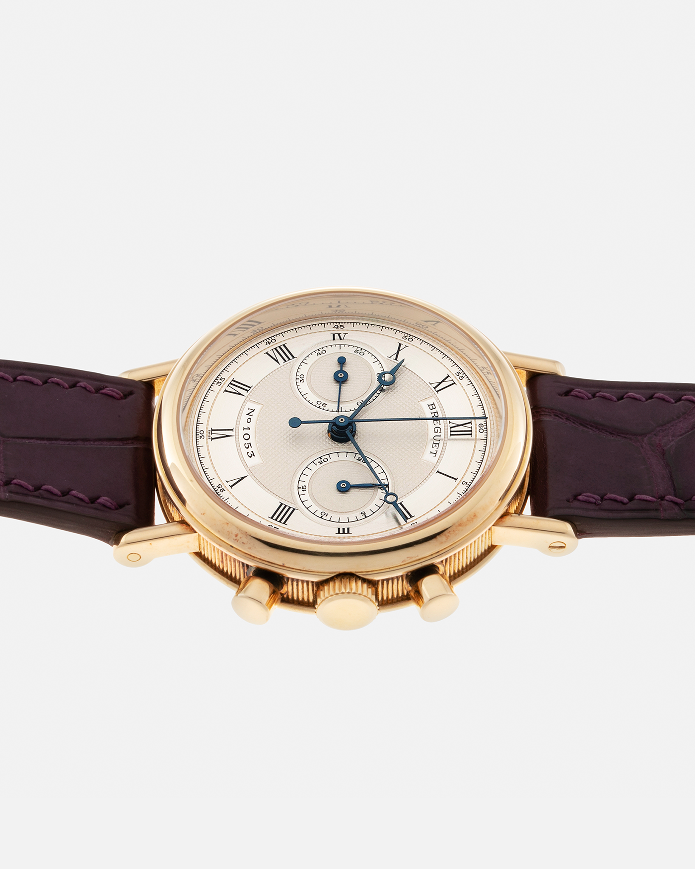 Brand: Breguet Year: 1990’s Model: Classique Chronograph Reference Number: 3237 Material: 18-carat Yellow Gold Movement: Lemania Cal. 2310, Manual-Winding Case Diameter: 36mm Lug Width: 18mm Strap: Unbranded Dark Purple Alligator Leather Strap with Signed 18-carat Yellow Gold Breguet Tang Buckle