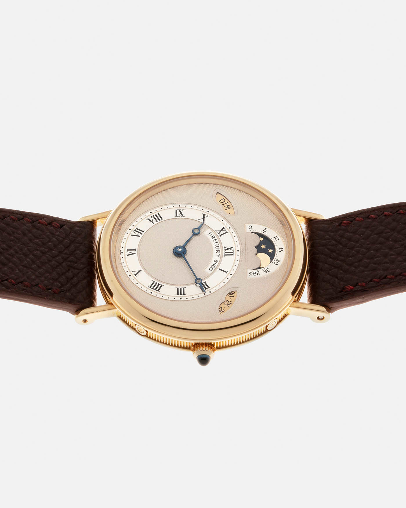 Brand: Breguet Year: 1990’s Model: Classique Day-Date Moon Phase Reference: 3337 Material: 18-carat Yellow Gold Movement: Breguet Cal. 502, Self-Winding Case Diameter: 36mm Lug Width: 18mm Strap: Generic Mahogany Brown Textured Calf Leather with Signed 18-carat Yellow Gold Tang Buckle