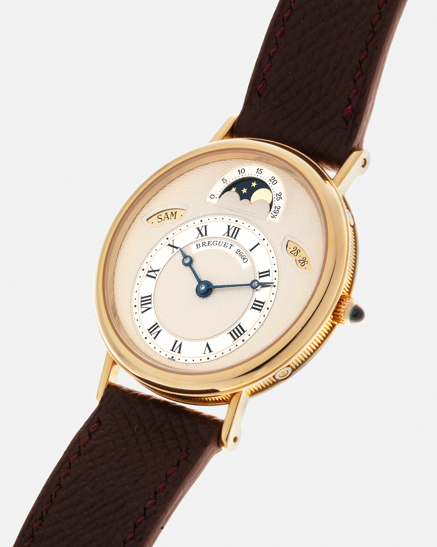 Brand: Breguet Year: 1990’s Model: Classique Day-Date Moon Phase Reference: 3337 Material: 18-carat Yellow Gold Movement: Breguet Cal. 502, Self-Winding Case Diameter: 36mm Lug Width: 18mm Strap: Generic Mahogany Brown Textured Calf Leather with Signed 18-carat Yellow Gold Tang Buckle