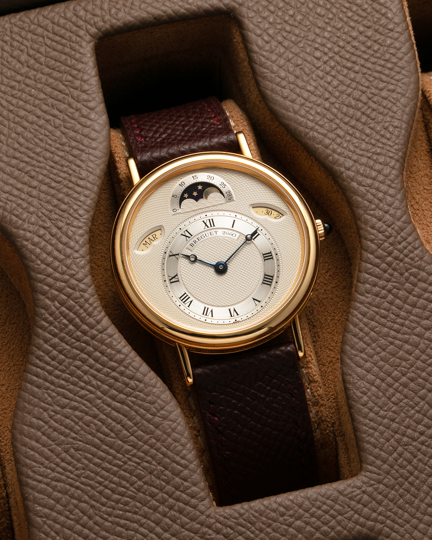 Brand: Breguet Year: 1990’s Model: Classique Day-Date Moon Phase Reference: 3337 Material: 18-carat Yellow Gold Movement: Breguet Cal. 502, Self-Winding Case Diameter: 36mm Lug Width: 18mm Strap: Generic Mahogany Brown Textured Calf Leather with Signed 18-carat Yellow Gold Tang Buckle