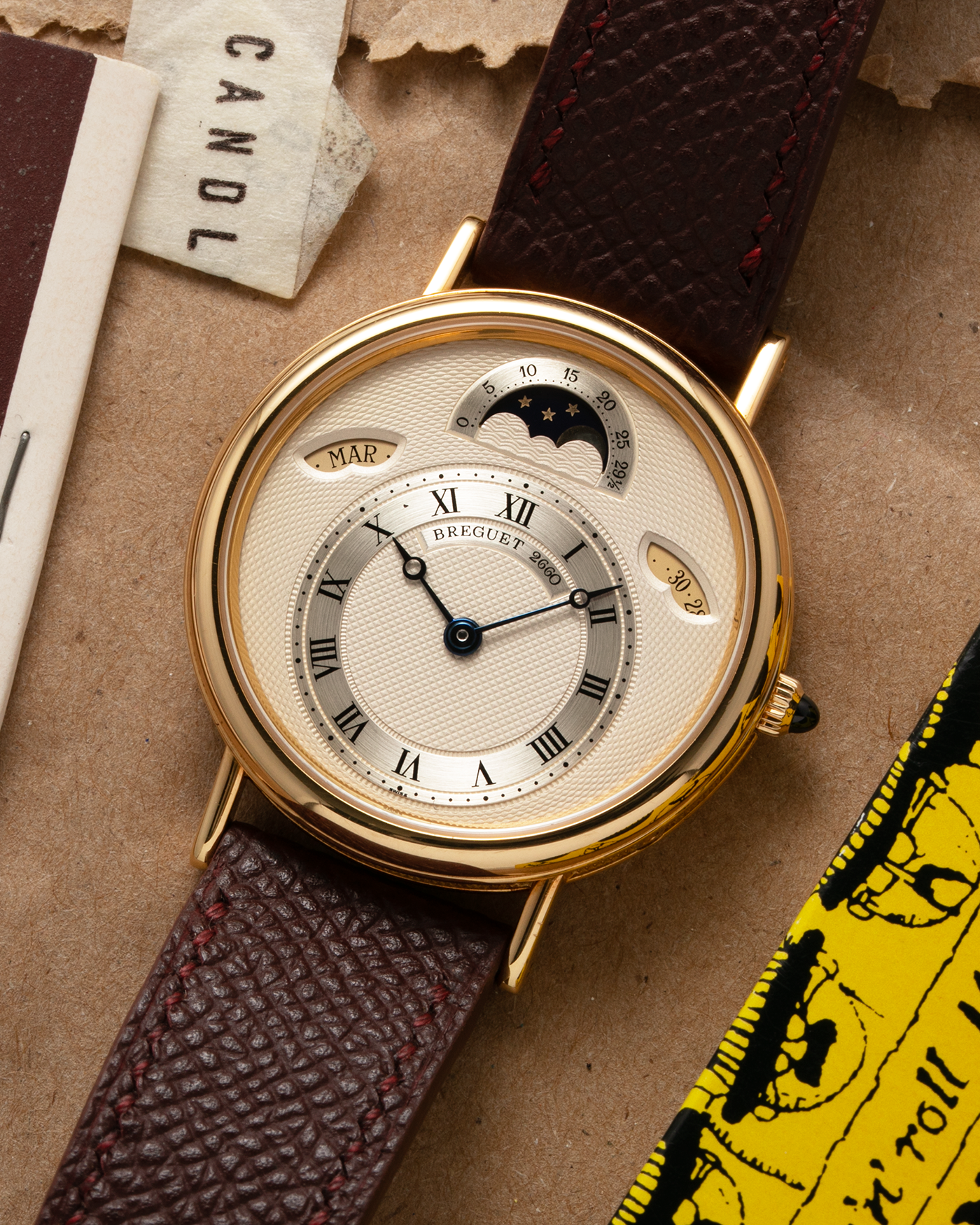 Brand: Breguet Year: 1990’s Model: Classique Day-Date Moon Phase Reference: 3337 Material: 18-carat Yellow Gold Movement: Breguet Cal. 502, Self-Winding Case Diameter: 36mm Lug Width: 18mm Strap: Generic Mahogany Brown Textured Calf Leather with Signed 18-carat Yellow Gold Tang Buckle