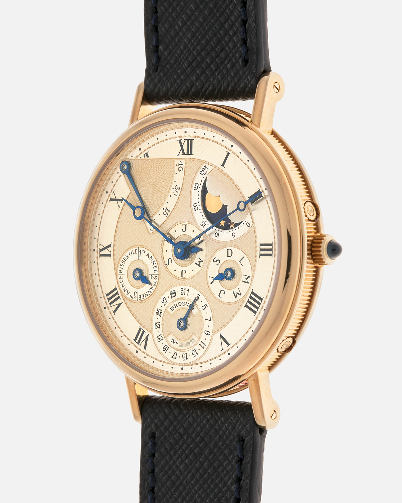 Brand: Breguet
Year: 1994 C Series
Model: Classique Quantième Perpétuel
Reference: 3310BA
Material: 18-carat Yellow Gold
Movement: Breguet Cal. 502 DRP, Self-Winding (based on the Frédéric Piguet Cal. 71)
Case Dimensions: 36mm x 8mm (Lug-to-Lug mm 43.5mm)
Lug Width: 18 mm
Strap: Molequin Dark Navy Textured Calf Leather Strap with Signed 18-carat Yellow Gold Tang Buckle