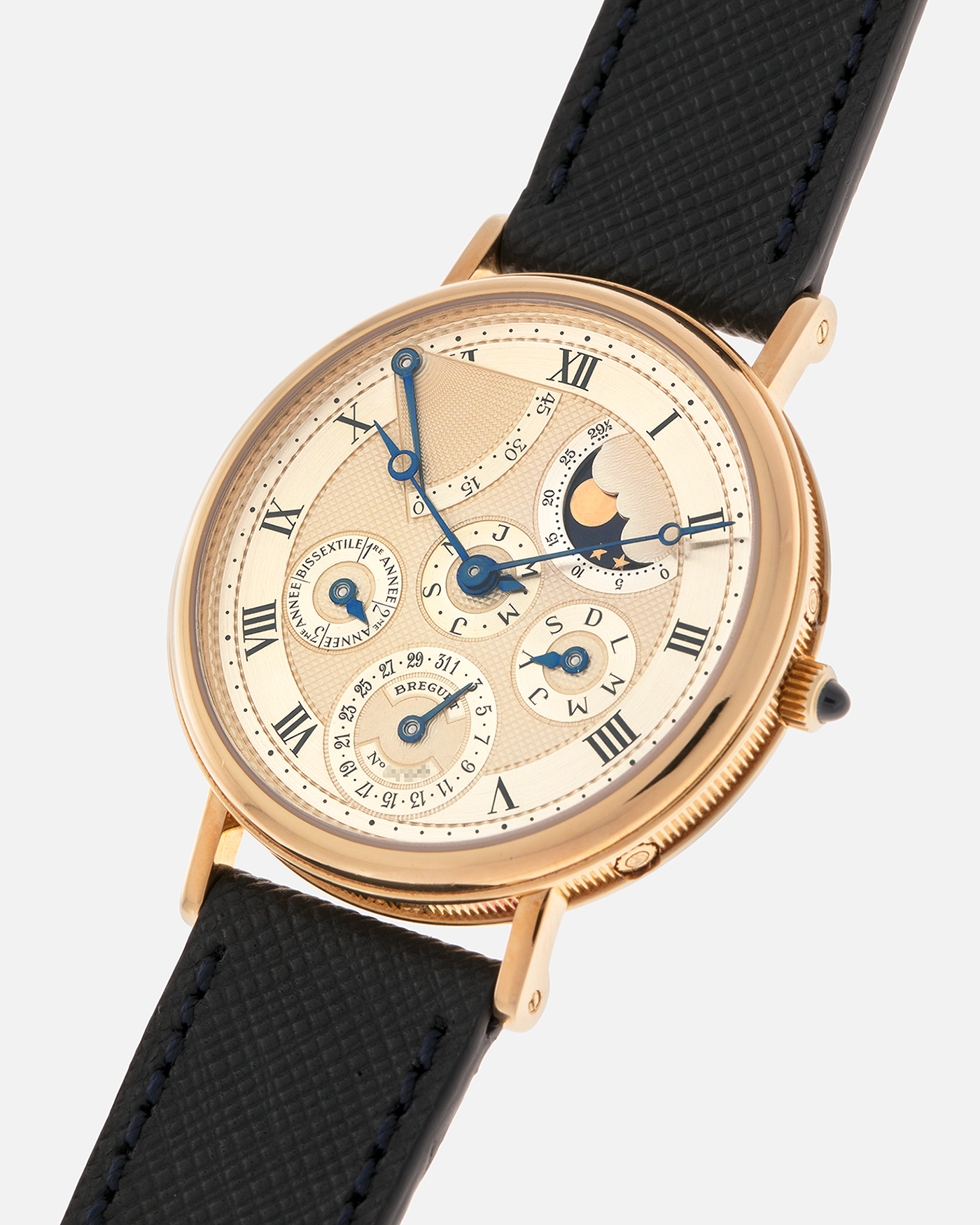 Brand: Breguet
Year: 1994 C Series
Model: Classique Quantième Perpétuel
Reference: 3310BA
Material: 18-carat Yellow Gold
Movement: Breguet Cal. 502 DRP, Self-Winding (based on the Frédéric Piguet Cal. 71)
Case Dimensions: 36mm x 8mm (Lug-to-Lug mm 43.5mm)
Lug Width: 18 mm
Strap: Molequin Dark Navy Textured Calf Leather Strap with Signed 18-carat Yellow Gold Tang Buckle