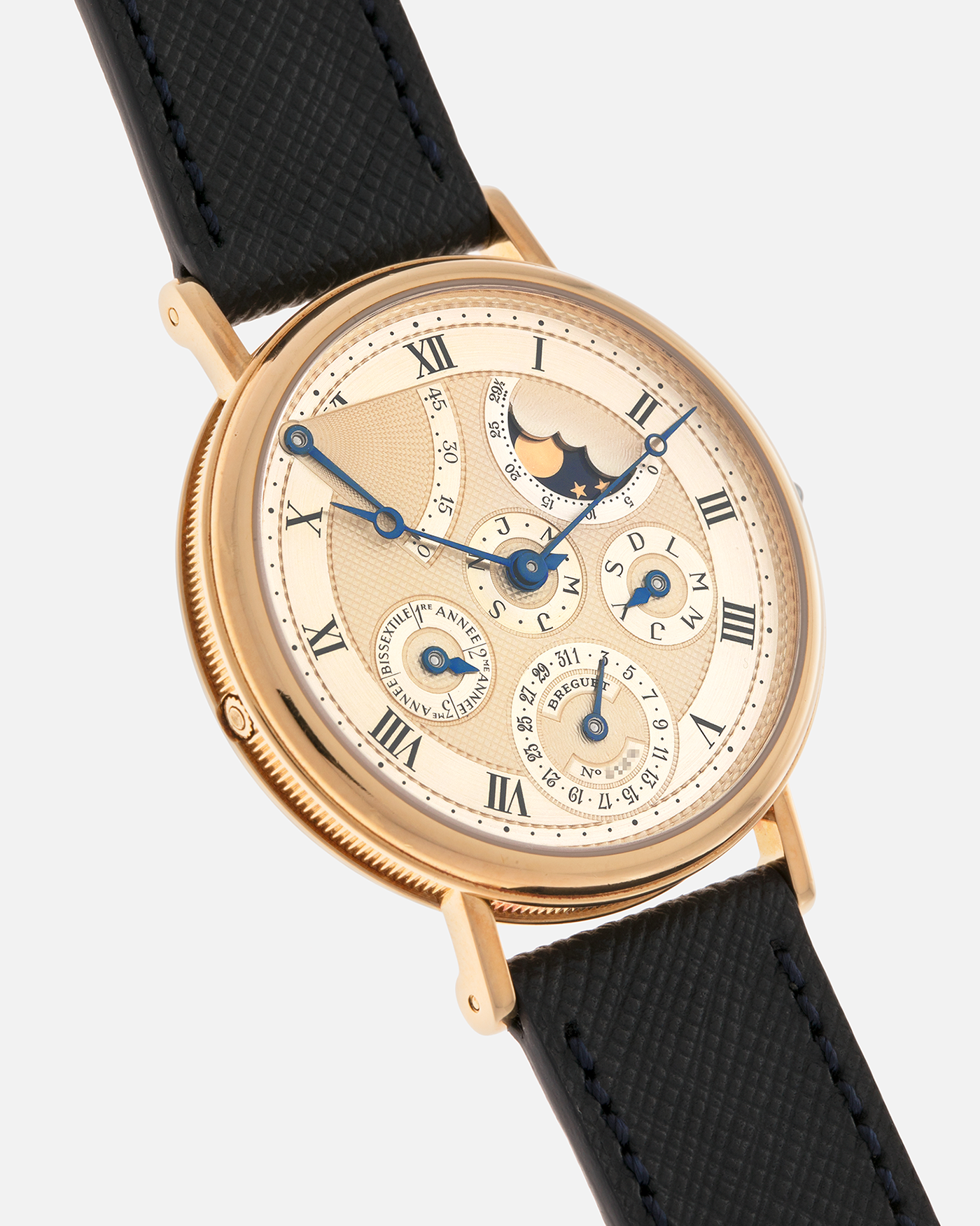 Brand: Breguet
Year: 1994 C Series
Model: Classique Quantième Perpétuel
Reference: 3310BA
Material: 18-carat Yellow Gold
Movement: Breguet Cal. 502 DRP, Self-Winding (based on the Frédéric Piguet Cal. 71)
Case Dimensions: 36mm x 8mm (Lug-to-Lug mm 43.5mm)
Lug Width: 18 mm
Strap: Molequin Dark Navy Textured Calf Leather Strap with Signed 18-carat Yellow Gold Tang Buckle