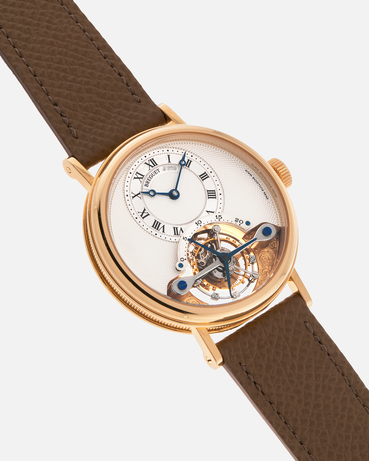 Brand: Breguet
Year: 2000-2001, K Series
Model: Classique Tourbillon
Reference: 3357BA
Material: 18-carat Yellow Gold
Movement: Breguet Cal. 558, Manually Wound One Minute Tourbillon
Case Dimensions: 35mm Diameter 9mm Thickness
Lug Width: 18 mm
Strap: Nostime Taupe Textured Calf Strap and 18k Yellow Gold Breguet Deployant