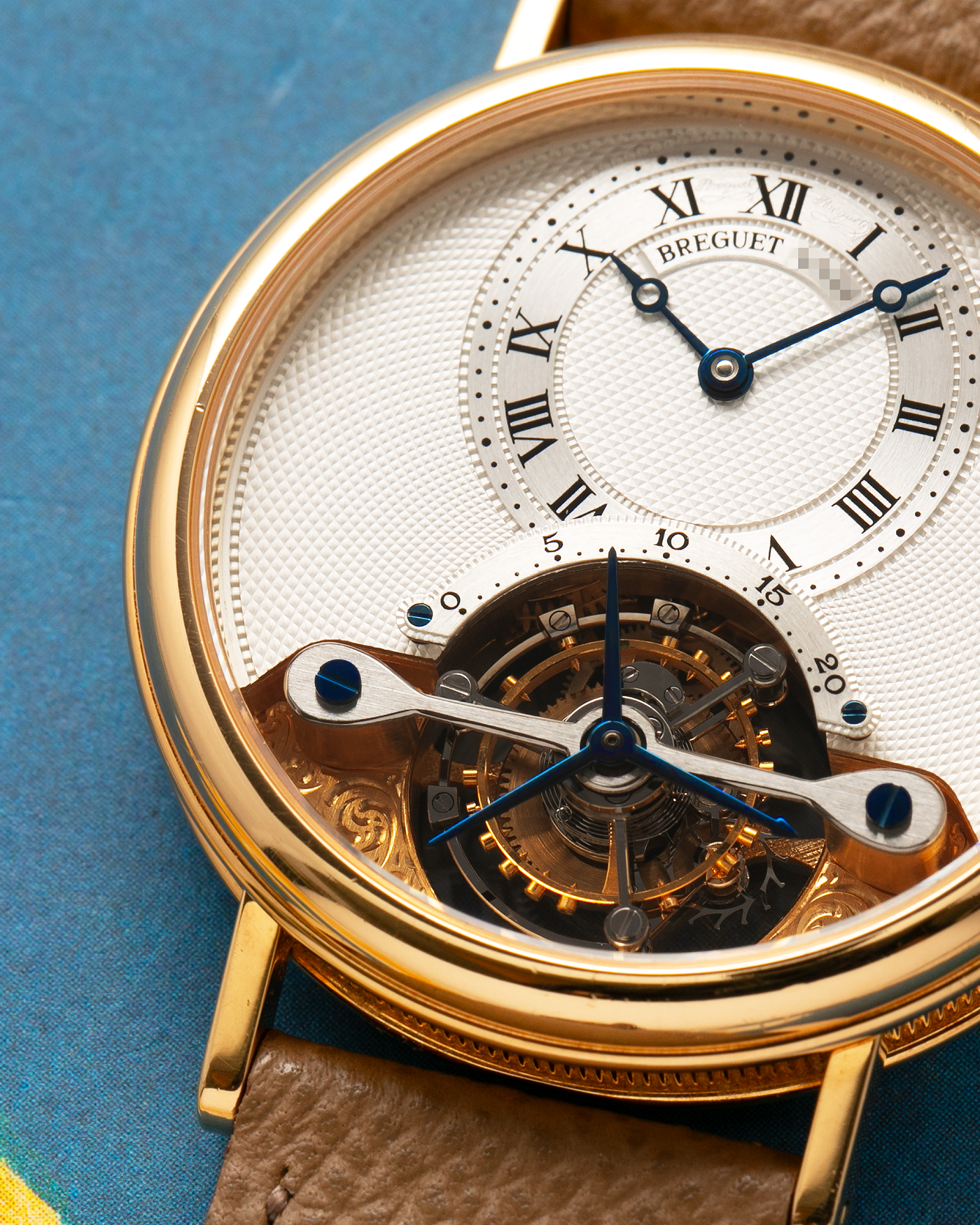 Brand: Breguet
Year: 2000-2001, K Series
Model: Classique Tourbillon
Reference: 3357BA
Material: 18-carat Yellow Gold
Movement: Breguet Cal. 558, Manually Wound One Minute Tourbillon
Case Dimensions: 35mm Diameter 9mm Thickness
Lug Width: 18 mm
Strap: Nostime Taupe Textured Calf Strap and 18k Yellow Gold Breguet Deployant