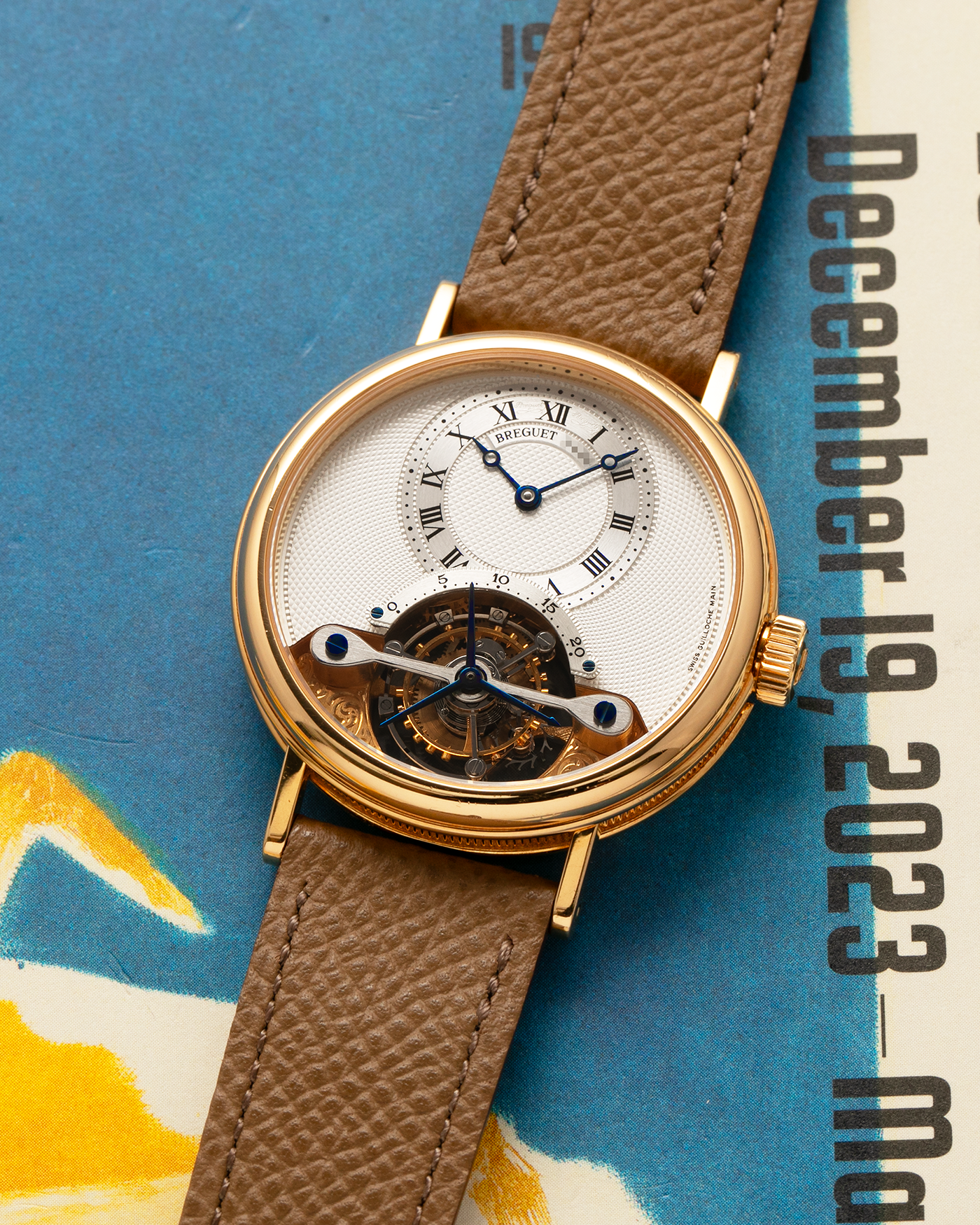 Brand: Breguet
Year: 2000-2001, K Series
Model: Classique Tourbillon
Reference: 3357BA
Material: 18-carat Yellow Gold
Movement: Breguet Cal. 558, Manually Wound One Minute Tourbillon
Case Dimensions: 35mm Diameter 9mm Thickness
Lug Width: 18 mm
Strap: Nostime Taupe Textured Calf Strap and 18k Yellow Gold Breguet Deployant