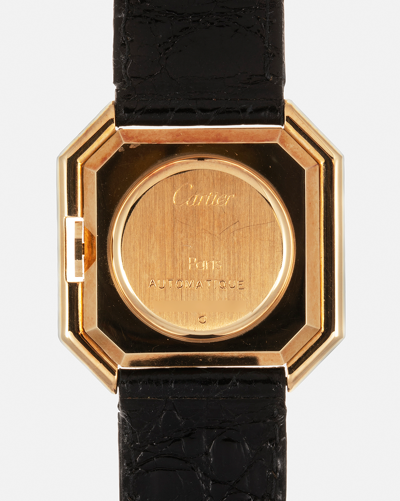 Brand: Cartier Year: 1970s Model: Ceinture ‘Jumbo’ Reference Number: AS03953 Material: 18-carat Yellow Gold Movement: Cartier Cal. 78.1. Manual-Winding Case Diameter: 31mm x 33mm Strap: Cartier Black Textured Leather Strap with Signed 18-carat Yellow Gold