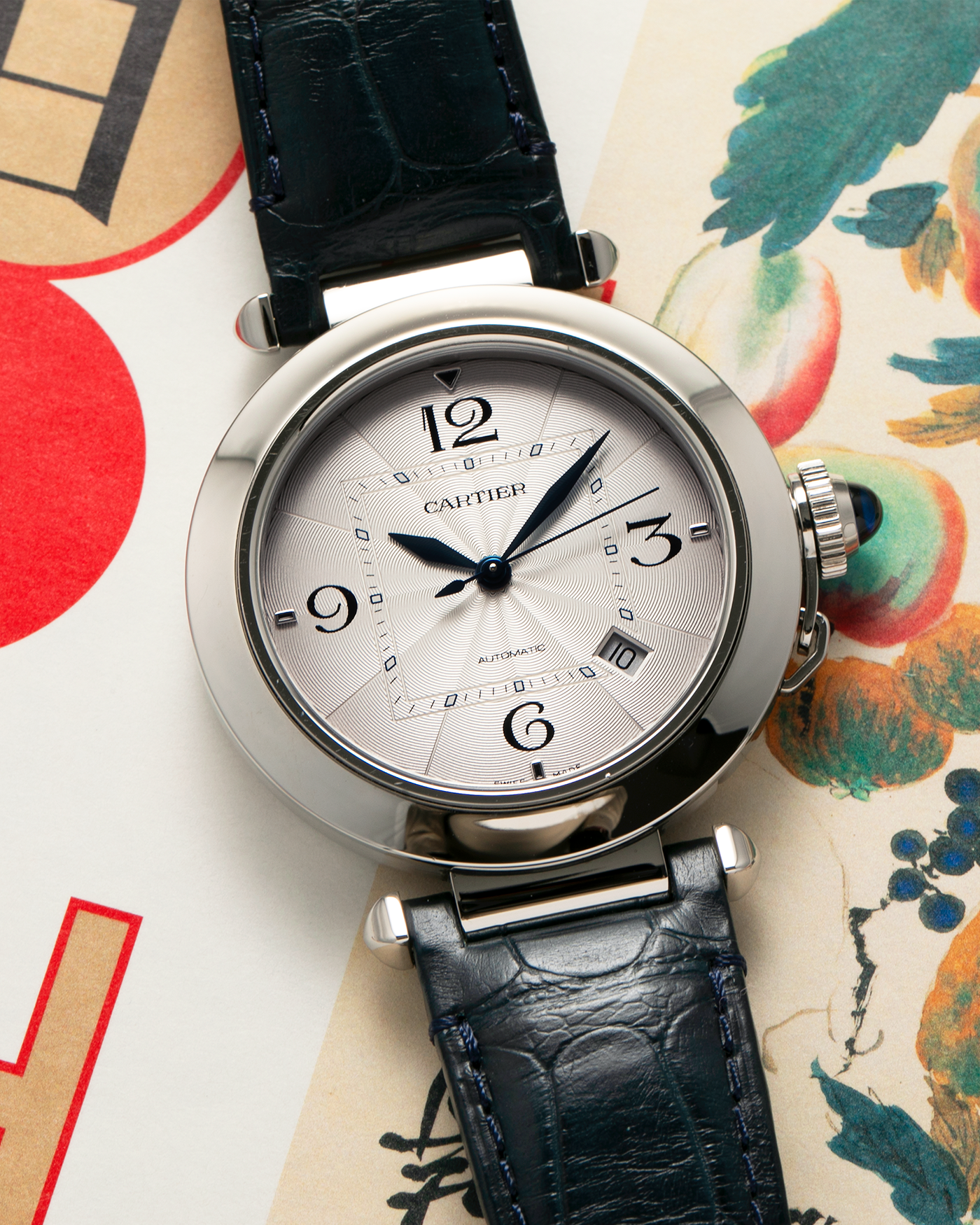 Brand: Cartier
Year: 2021
Model: Pasha 41
Reference Number: 4266, WSPA0010
Material: Stainless Steel
Movement: Cartier Cal. 1847, Self-Winding
Case Dimensions: 41mm x 9.55mm (Lug-to-Lug 47.5mm)
Lug Width: 20mm
Straps: Cartier Dark Blue Alligator Leather Strap with Signed Stainless Steel Deployant Clasp, extra Cartier Dark Grey Alligator Leather Strap