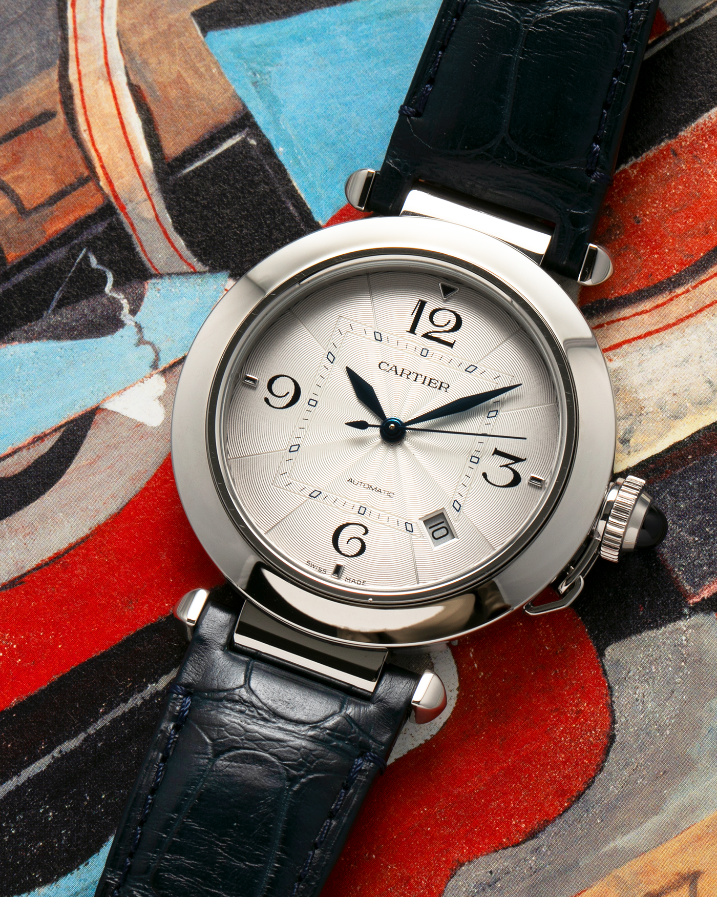 Brand: Cartier
Year: 2021
Model: Pasha 41
Reference Number: 4266, WSPA0010
Material: Stainless Steel
Movement: Cartier Cal. 1847, Self-Winding
Case Dimensions: 41mm x 9.55mm (Lug-to-Lug 47.5mm)
Lug Width: 20mm
Straps: Cartier Dark Blue Alligator Leather Strap with Signed Stainless Steel Deployant Clasp, extra Cartier Dark Grey Alligator Leather Strap