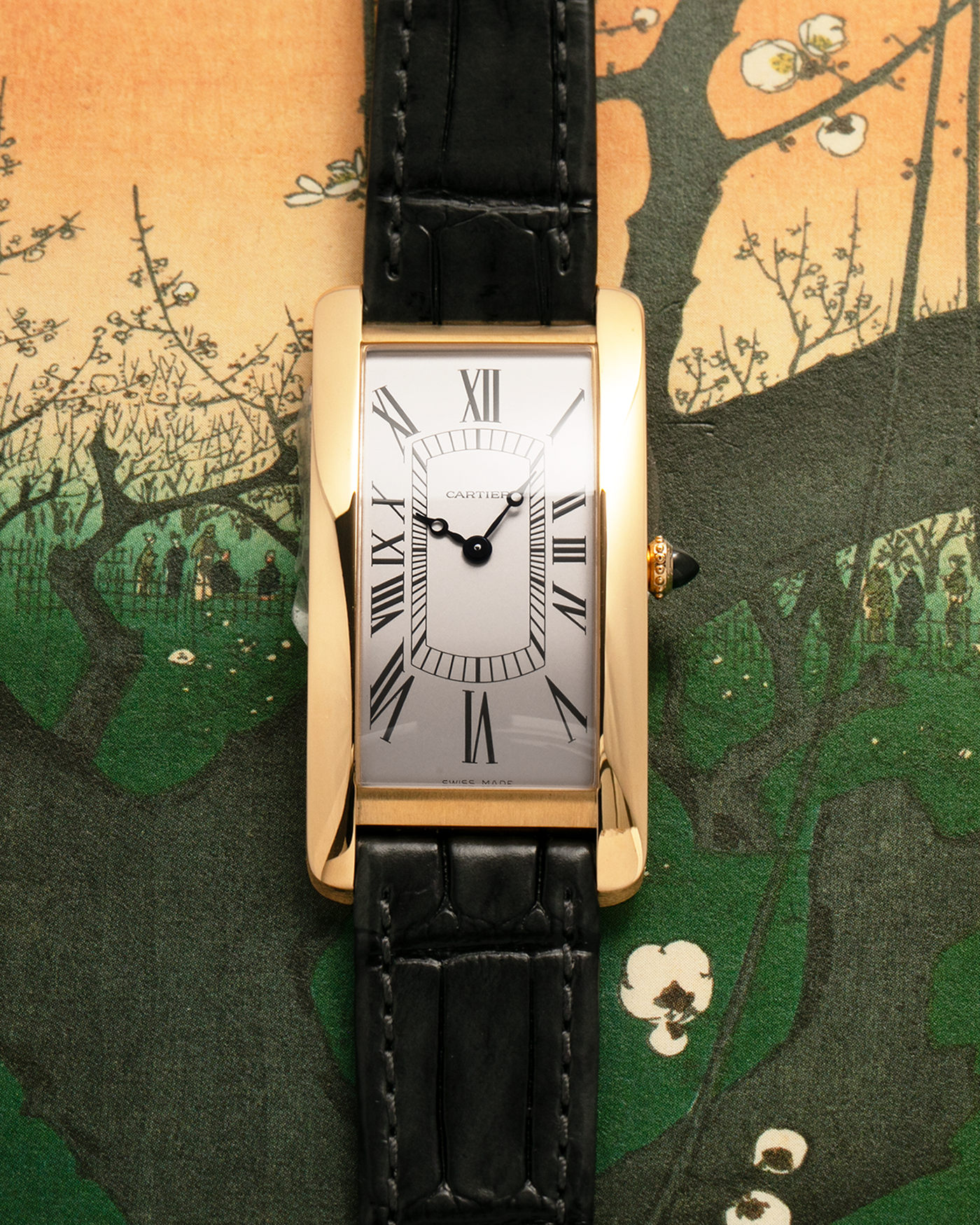 Brand: Cartier
Year: 2026
Model: Privé La Collection Tank Cintrée
Reference: WHTA0037
Material: 18k Yellow Gold
Movement: Cartier Cal. 1917 MC, Manual-Winding
Case Diameter: 46.3mm x 23 mm (6.95mm Thick)
Lug Width: 16mm
Strap: Cartier Grey Alligator Leather Strap with Cartier Signed 18k Yellow Gold Tang Buckle