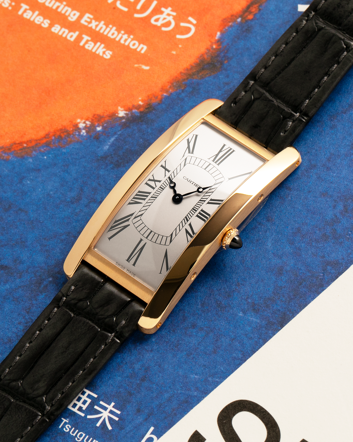 Brand: Cartier
Year: 2026
Model: Privé La Collection Tank Cintrée
Reference: WHTA0037
Material: 18k Yellow Gold
Movement: Cartier Cal. 1917 MC, Manual-Winding
Case Diameter: 46.3mm x 23 mm (6.95mm Thick)
Lug Width: 16mm
Strap: Cartier Grey Alligator Leather Strap with Cartier Signed 18k Yellow Gold Tang Buckle