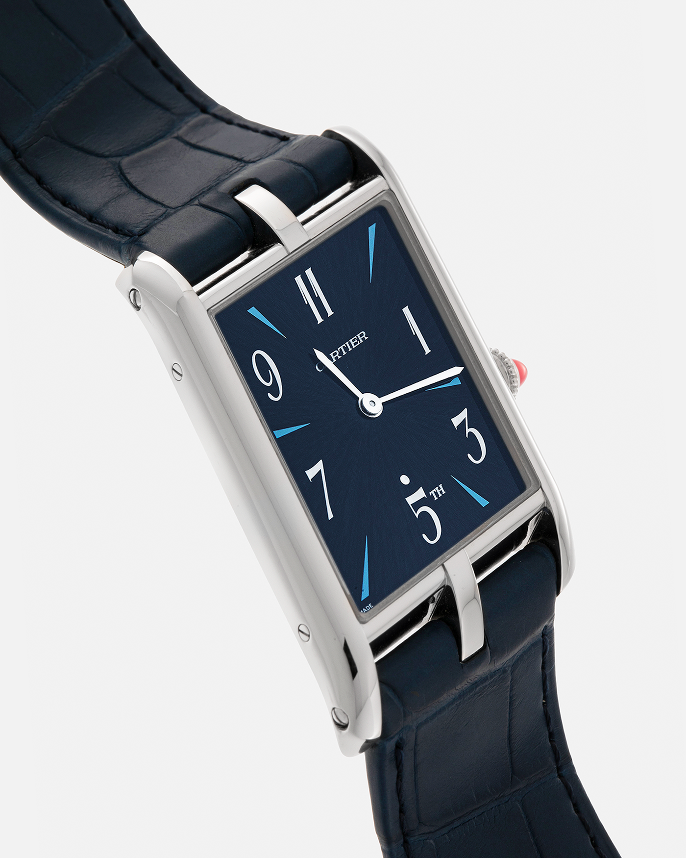 Brand: Cartier
Year: 2024
Model: Privé Tank Asymétrique 5th Ave New York Edition
Reference: WGTA0120
Material:  Platinum 950
Movement: Cartier Cal. 1917MC, Manual-Winding
Case Dimensions: 47mm x 26mm x 6.4mm (44.5mm Lug-to-Lug)
Strap: Cartier Blue Alligator Leather Strap with Signed Platinum 950 Tang Buckle