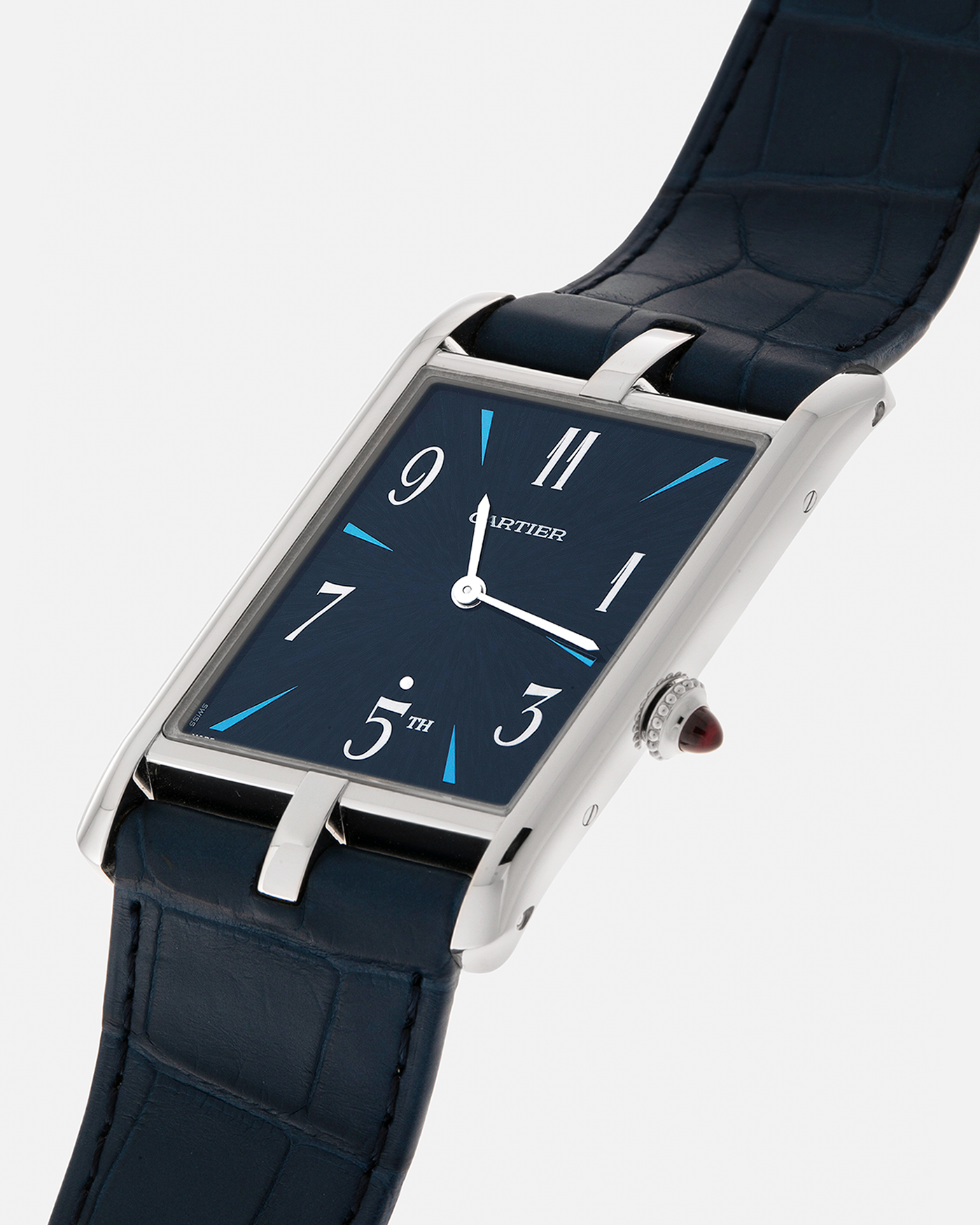 Brand: Cartier
Year: 2024
Model: Privé Tank Asymétrique 5th Ave New York Edition
Reference: WGTA0120
Material:  Platinum 950
Movement: Cartier Cal. 1917MC, Manual-Winding
Case Dimensions: 47mm x 26mm x 6.4mm (44.5mm Lug-to-Lug)
Strap: Cartier Blue Alligator Leather Strap with Signed Platinum 950 Tang Buckle