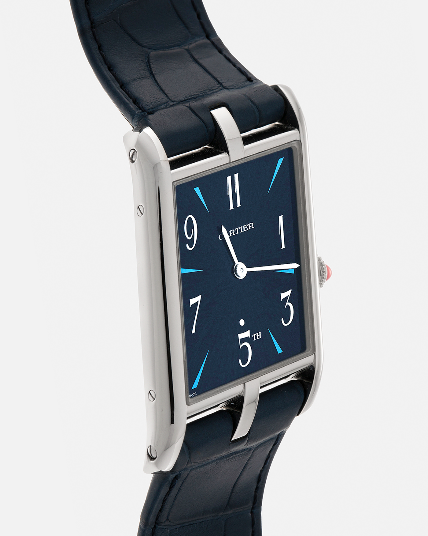 Brand: Cartier
Year: 2024
Model: Privé Tank Asymétrique 5th Ave New York Edition
Reference: WGTA0120
Material:  Platinum 950
Movement: Cartier Cal. 1917MC, Manual-Winding
Case Dimensions: 47mm x 26mm x 6.4mm (44.5mm Lug-to-Lug)
Strap: Cartier Blue Alligator Leather Strap with Signed Platinum 950 Tang Buckle