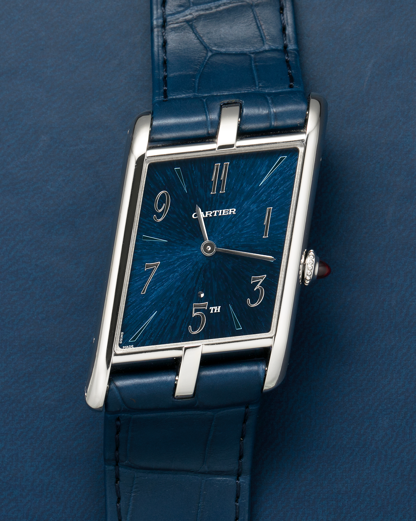Brand: Cartier
Year: 2024
Model: Privé Tank Asymétrique 5th Ave New York Edition
Reference: WGTA0120
Material:  Platinum 950
Movement: Cartier Cal. 1917MC, Manual-Winding
Case Dimensions: 47mm x 26mm x 6.4mm (44.5mm Lug-to-Lug)
Strap: Cartier Blue Alligator Leather Strap with Signed Platinum 950 Tang Buckle