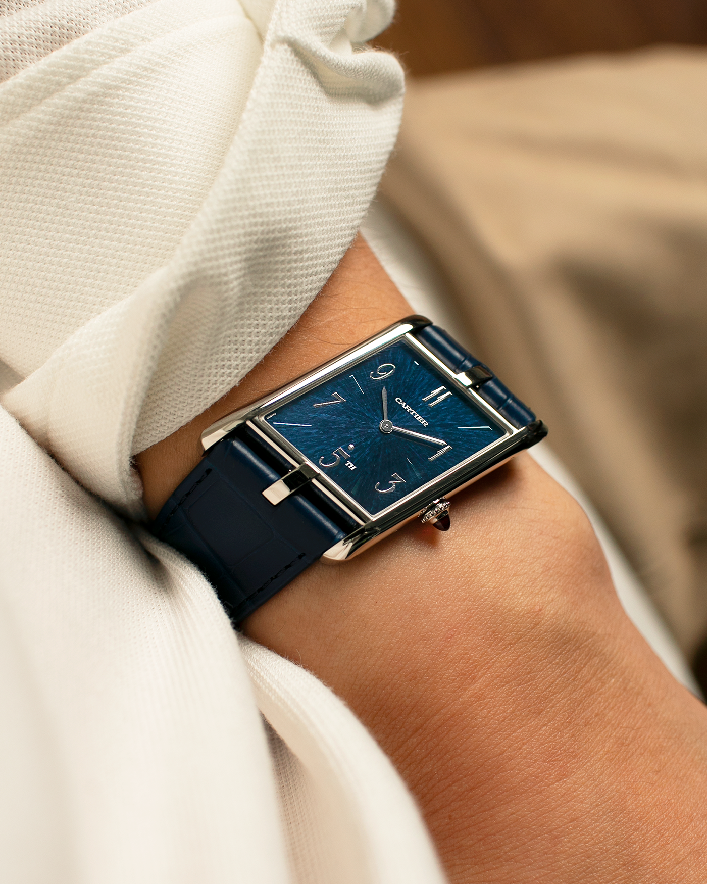 Brand: Cartier
Year: 2024
Model: Privé Tank Asymétrique 5th Ave New York Edition
Reference: WGTA0120
Material:  Platinum 950
Movement: Cartier Cal. 1917MC, Manual-Winding
Case Dimensions: 47mm x 26mm x 6.4mm (44.5mm Lug-to-Lug)
Strap: Cartier Blue Alligator Leather Strap with Signed Platinum 950 Tang Buckle