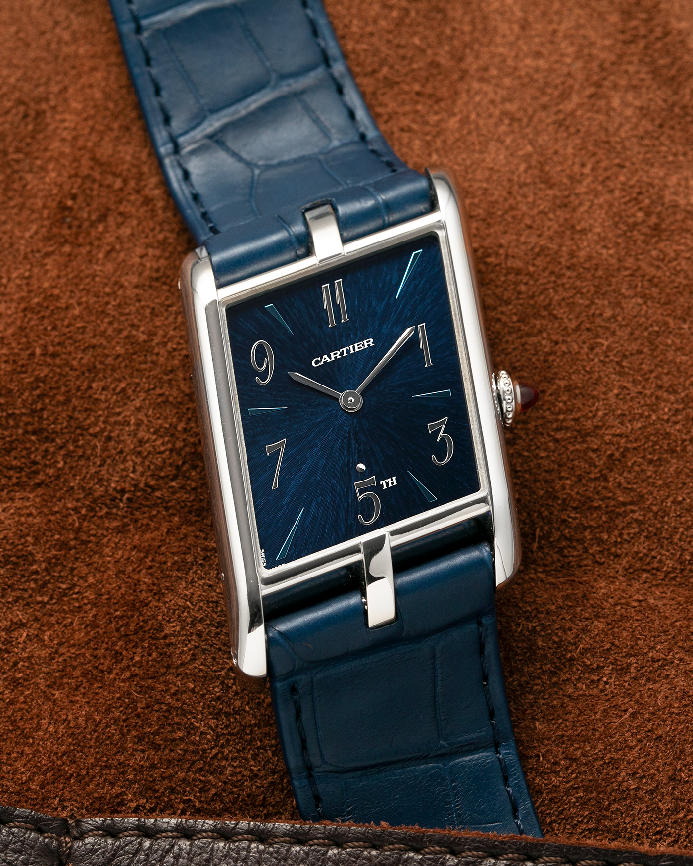 Brand: Cartier
Year: 2024
Model: Privé Tank Asymétrique 5th Ave New York Edition
Reference: WGTA0120
Material:  Platinum 950
Movement: Cartier Cal. 1917MC, Manual-Winding
Case Dimensions: 47mm x 26mm x 6.4mm (44.5mm Lug-to-Lug)
Strap: Cartier Blue Alligator Leather Strap with Signed Platinum 950 Tang Buckle
