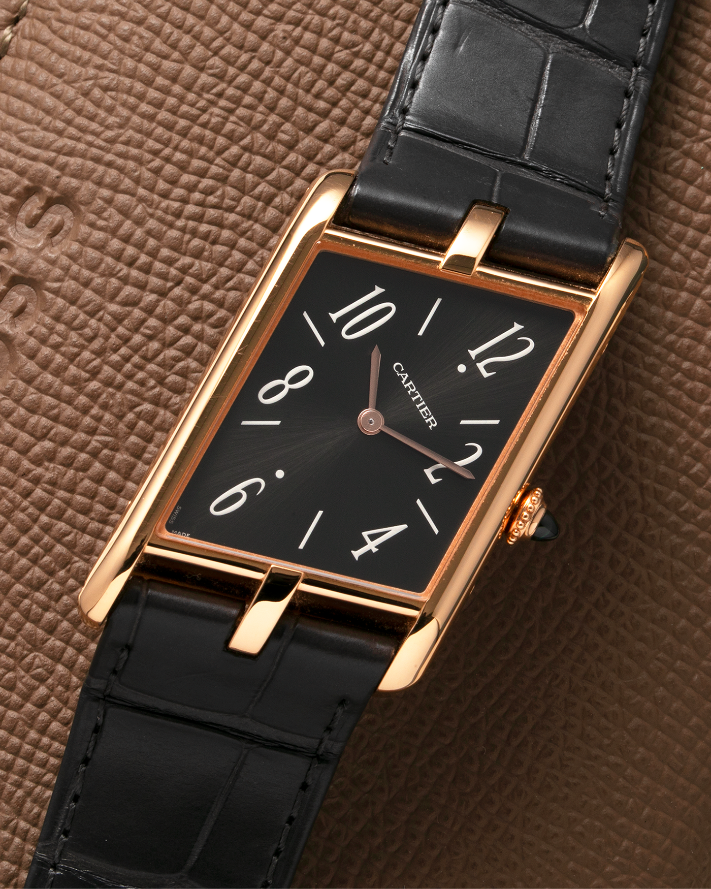 Brand: Cartier Year: 2022 Model: Privé Tank Asymétrique Reference: WGTA0043 Material: 18-carat Red Gold Movement: Cal. 1917MC, Manual-Winding Case Diameter: 47.15mm x 26.2mm x 6.38mm Strap: Cartier Grey Alligator Leather Strap with Signed 18-carat Red Gold Tang Buckle