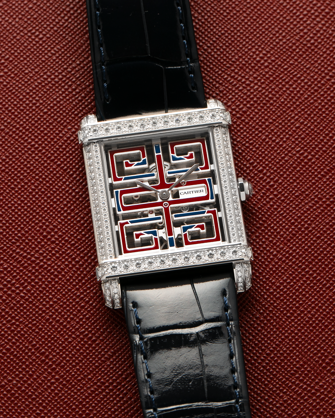 Brand: Cartier
Year: 2022
Model: Privé Tank Chinoise Skeleton, Limited Edition of 20 Pieces in this Configuration
Reference Number: CRHPI01507
Material: Platinum 950 Case, Lacquered Movement Bridges, Diamond-Setting on Case
Movement: Cartier Cal. 9627 MC, Manual-Winding
Case Dimensions: 39.5mm x 29mm x 8mm (Lug-to-Lug 40mm)
Lug Width: 21mm
Strap: Cartier Black Alligator Leather Strap with Signed and Diamond-Set Platinum 950 Tang Buckle