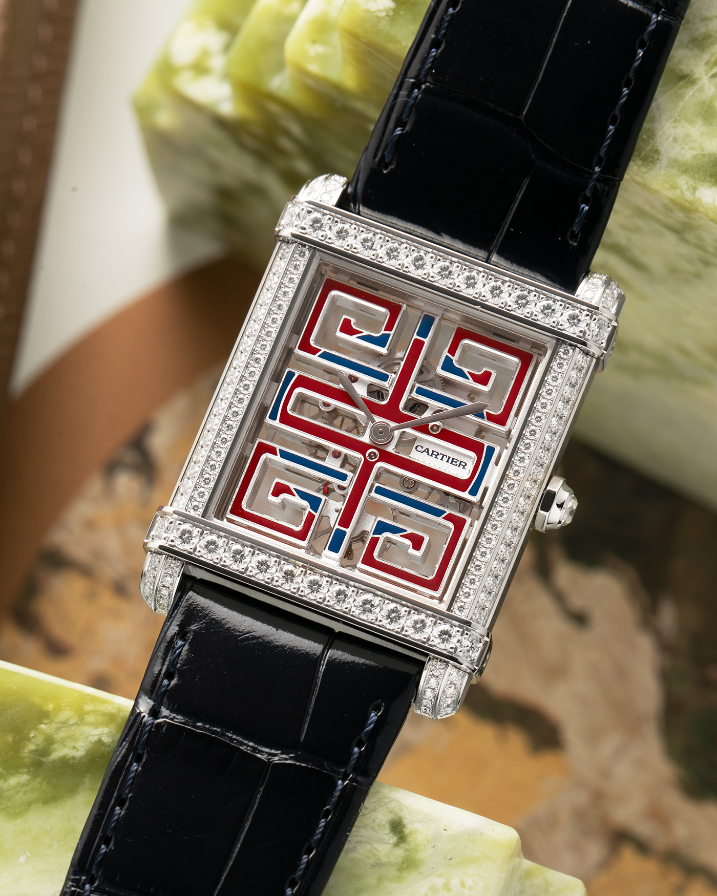 Brand: Cartier
Year: 2022
Model: Privé Tank Chinoise Skeleton, Limited Edition of 20 Pieces in this Configuration
Reference Number: CRHPI01507
Material: Platinum 950 Case, Lacquered Movement Bridges, Diamond-Setting on Case
Movement: Cartier Cal. 9627 MC, Manual-Winding
Case Dimensions: 39.5mm x 29mm x 8mm (Lug-to-Lug 40mm)
Lug Width: 21mm
Strap: Cartier Black Alligator Leather Strap with Signed and Diamond-Set Platinum 950 Tang Buckle