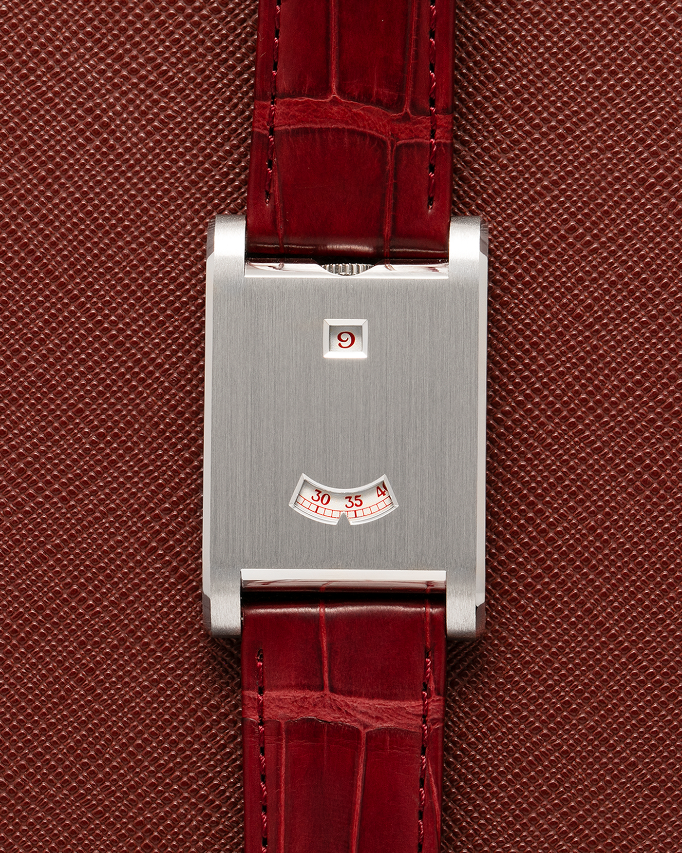 Brand: Cartier
Year: 2026
Model: Privé Tank à Guichets
Reference Number: 4124
Model Number: WGTA0027
Material: Platinum
Movement: Cartier Cal. 9755 MC (Based on Piaget Cal. 430P), Manual-Winding
Case Dimensions: 37.6mm Length 24.8mm Width 6mm Thickness
Lug Width: 18mm
Strap: Cartier Burgundy Alligator Leather Strap with Signed Platinum Tang Buckle