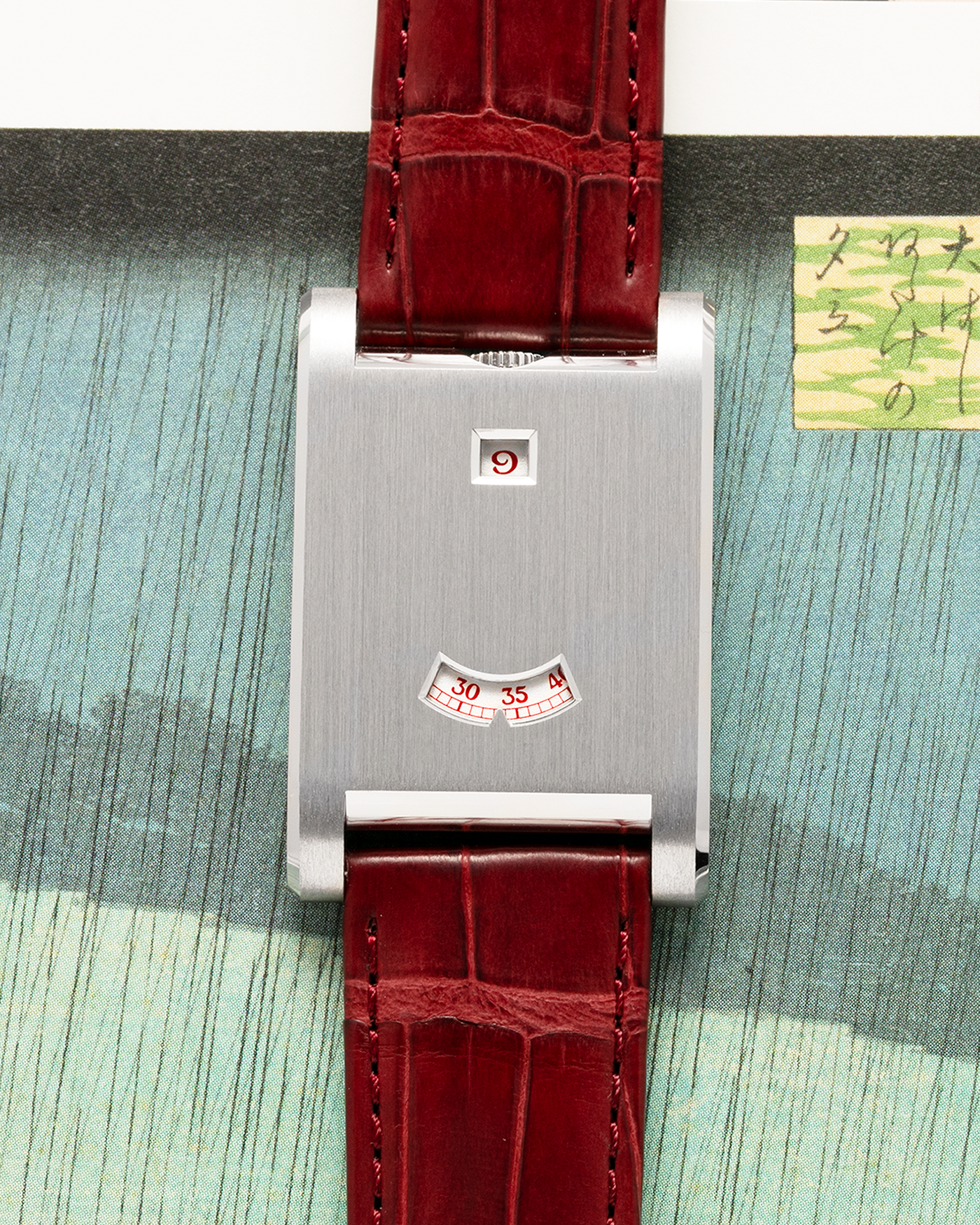 Brand: Cartier
Year: 2026
Model: Privé Tank à Guichets
Reference Number: 4124
Model Number: WGTA0027
Material: Platinum
Movement: Cartier Cal. 9755 MC (Based on Piaget Cal. 430P), Manual-Winding
Case Dimensions: 37.6mm Length 24.8mm Width 6mm Thickness
Lug Width: 18mm
Strap: Cartier Burgundy Alligator Leather Strap with Signed Platinum Tang Buckle