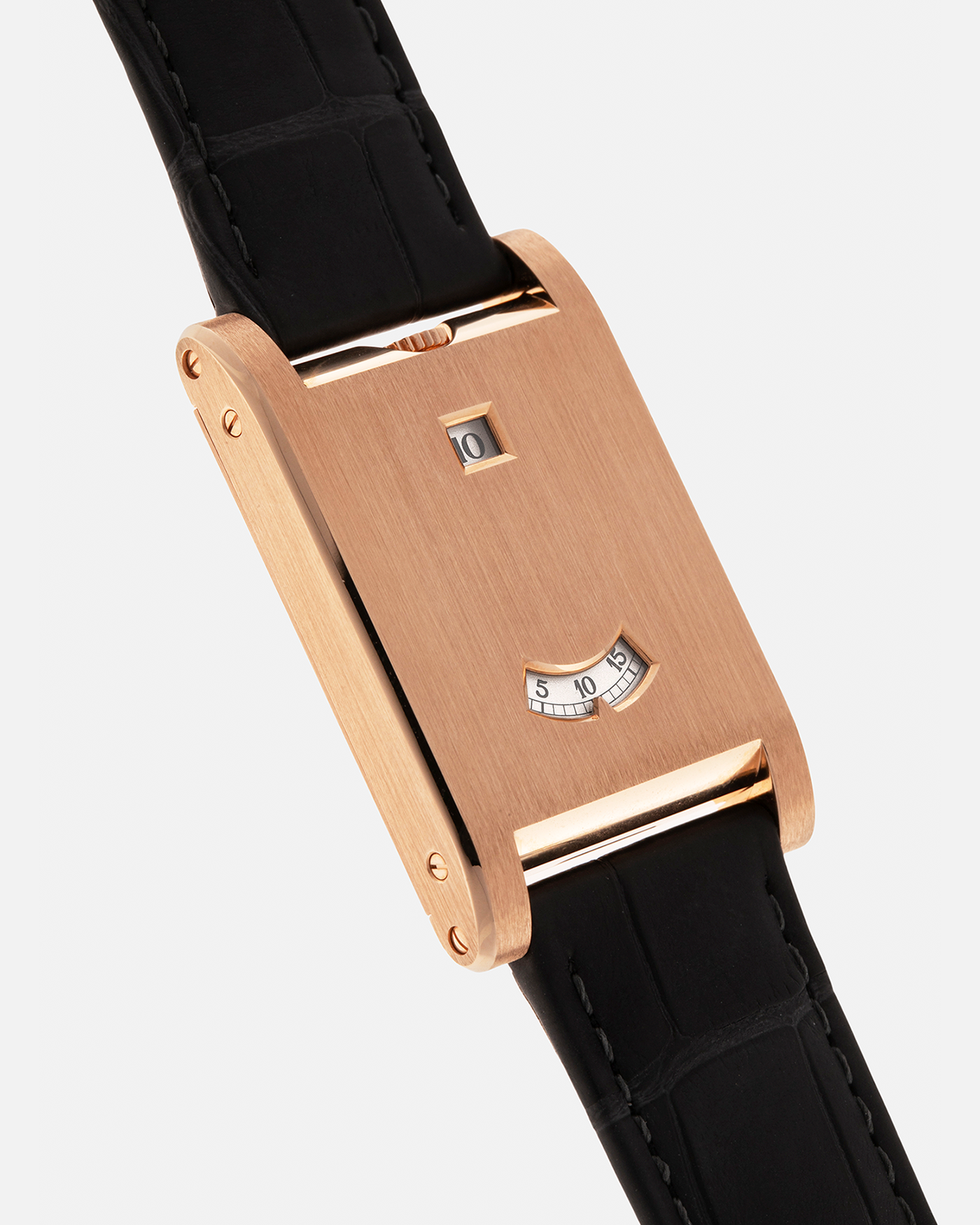 Brand: Cartier
Year: 2025
Model: Privé Tank à Guichets
Reference Number: 4581
Model Number: WGTA0235
Material: 18-carat Rose Gold
Movement: Cartier Cal. 9755 MC (Based on Piaget Cal. 430P), Manual-Winding
Case Dimensions: 37.6mm (Including Lugs) x 24.8mm x 6mm
Lug Width: 18mm
Strap: Cartier Dark Grey Alligator Leather Strap with Signed 18-carat Rose Gold Tang Buckle