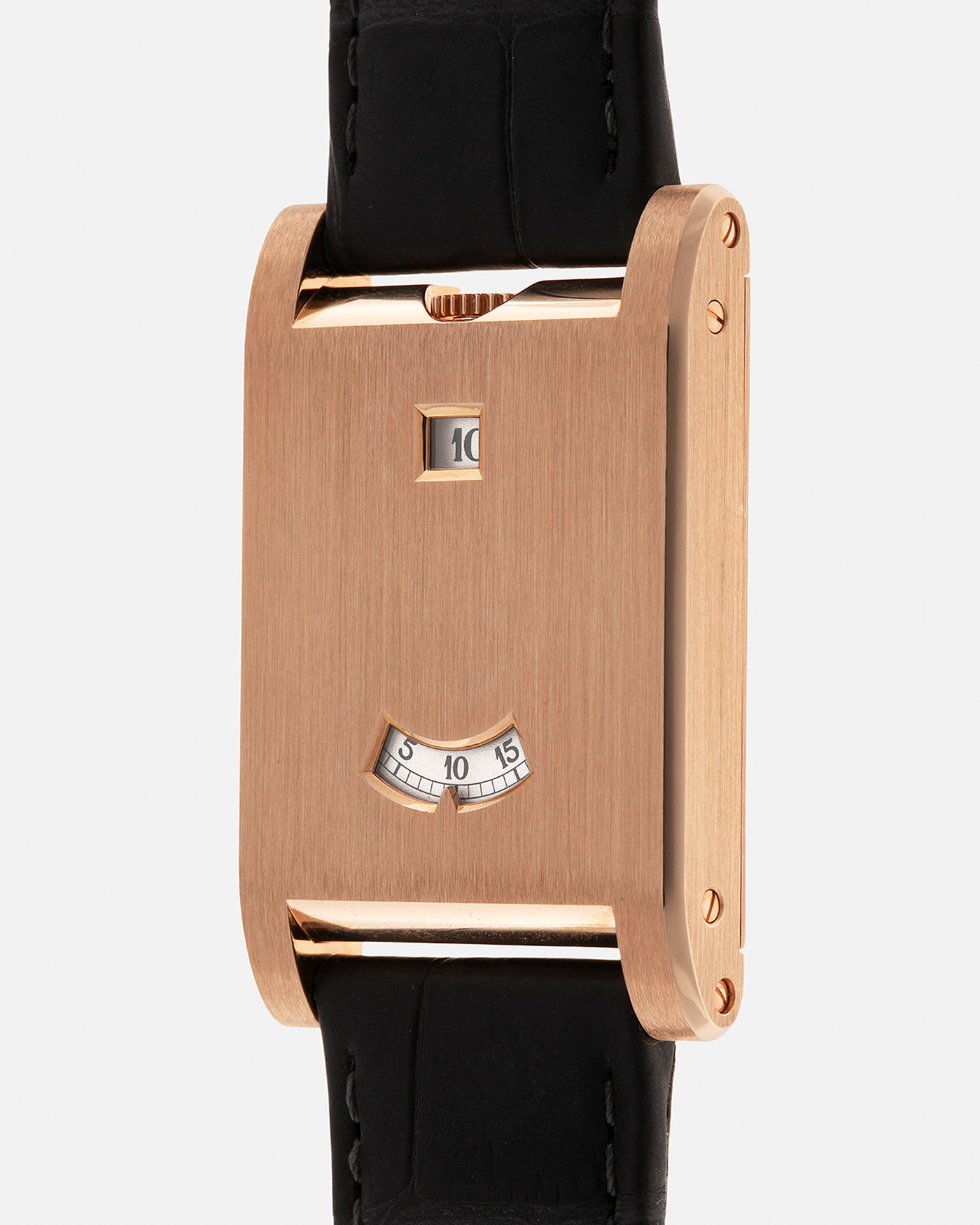 Brand: Cartier
Year: 2025
Model: Privé Tank à Guichets
Reference Number: 4581
Model Number: WGTA0235
Material: 18-carat Rose Gold
Movement: Cartier Cal. 9755 MC (Based on Piaget Cal. 430P), Manual-Winding
Case Dimensions: 37.6mm (Including Lugs) x 24.8mm x 6mm
Lug Width: 18mm
Strap: Cartier Dark Grey Alligator Leather Strap with Signed 18-carat Rose Gold Tang Buckle