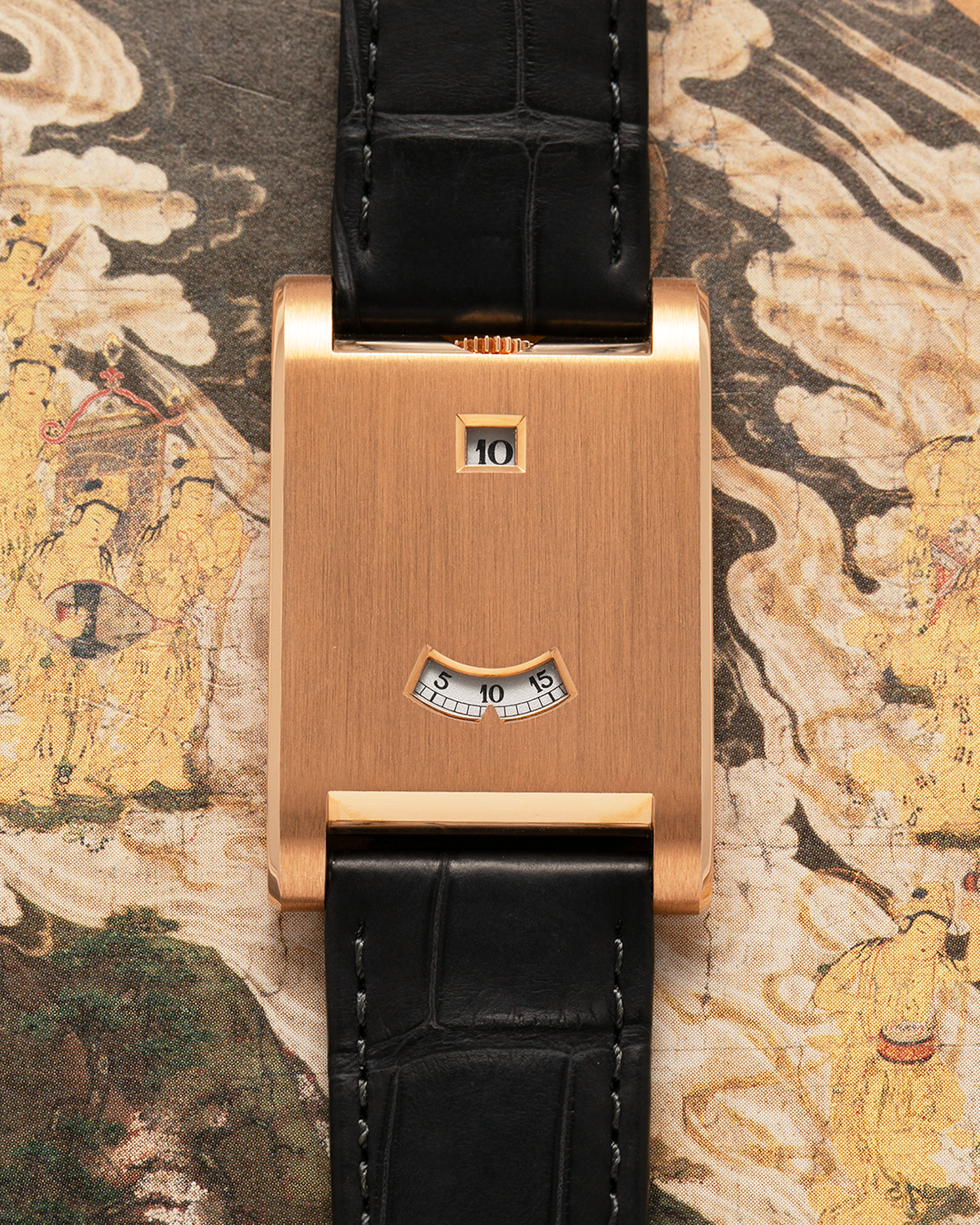 Brand: Cartier
Year: 2025
Model: Privé Tank à Guichets
Reference Number: 4581
Model Number: WGTA0235
Material: 18-carat Rose Gold
Movement: Cartier Cal. 9755 MC (Based on Piaget Cal. 430P), Manual-Winding
Case Dimensions: 37.6mm (Including Lugs) x 24.8mm x 6mm
Lug Width: 18mm
Strap: Cartier Dark Grey Alligator Leather Strap with Signed 18-carat Rose Gold Tang Buckle