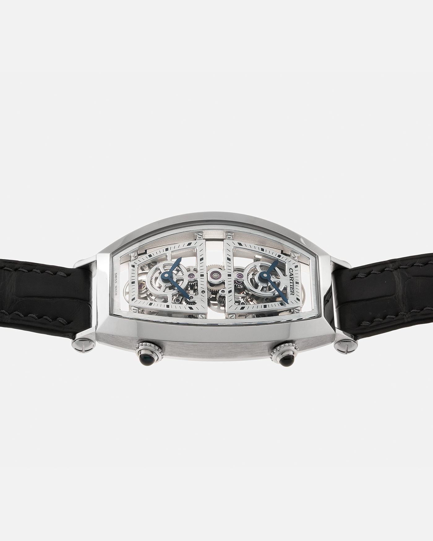 Brand: Cartier Year: 2022 Model: Privé Tonneau Skeleton Dual Time, Limited Edition of 100 pieces only Reference: CRWHTN0006 Material: Platinum 950 Case, 18-carat White Gold Deployant Clasp Movement: Cartier Cal. 9919 MC, Manual-Winding Case Dimensions: 52.4mm x 29.4mm Strap: Cartier Navy Alligator Leather Strap with Signed 18-carat White Gold Deployant Clasp, with two additional Cartier Black and Blue Alligator Leather Straps