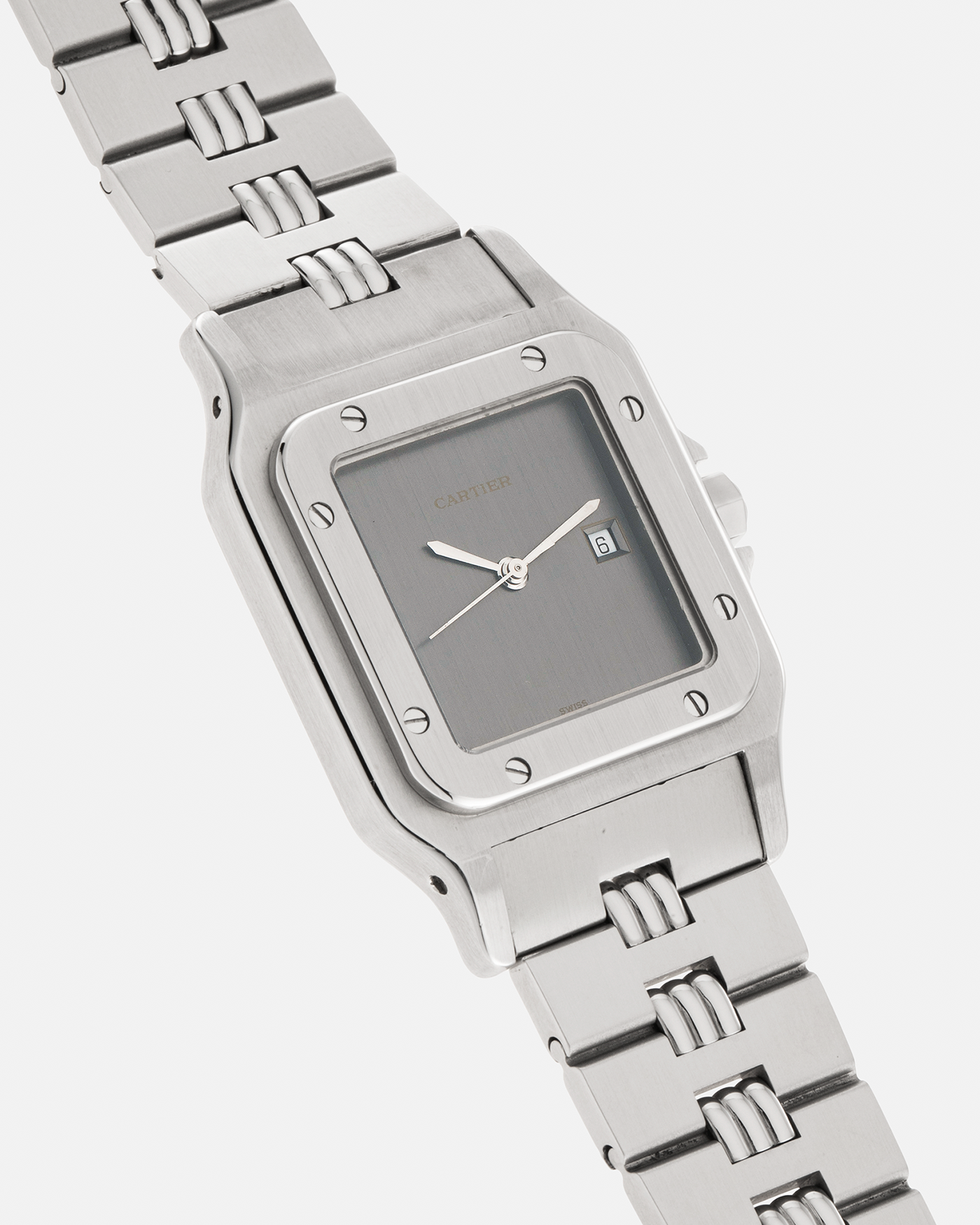 Brand: Cartier Year: 1980s Model: Santos ‘Carrée’ Reference: 2960 Material: Stainless Steel Movement: Cartier Cal. 077 (ETA Cal. 3671 Based), Self-Winding Case Dimensions: 29mm x 40.5mm Lug Width: 18mm Strap: Cartier Stainless Steel Godron ‘541811’ Bracelet with Signed Clasp