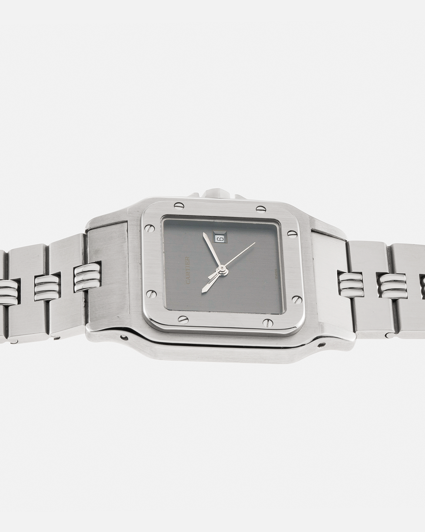 Brand: Cartier Year: 1980s Model: Santos ‘Carrée’ Reference: 2960 Material: Stainless Steel Movement: Cartier Cal. 077 (ETA Cal. 3671 Based), Self-Winding Case Dimensions: 29mm x 40.5mm Lug Width: 18mm Strap: Cartier Stainless Steel Godron ‘541811’ Bracelet with Signed Clasp