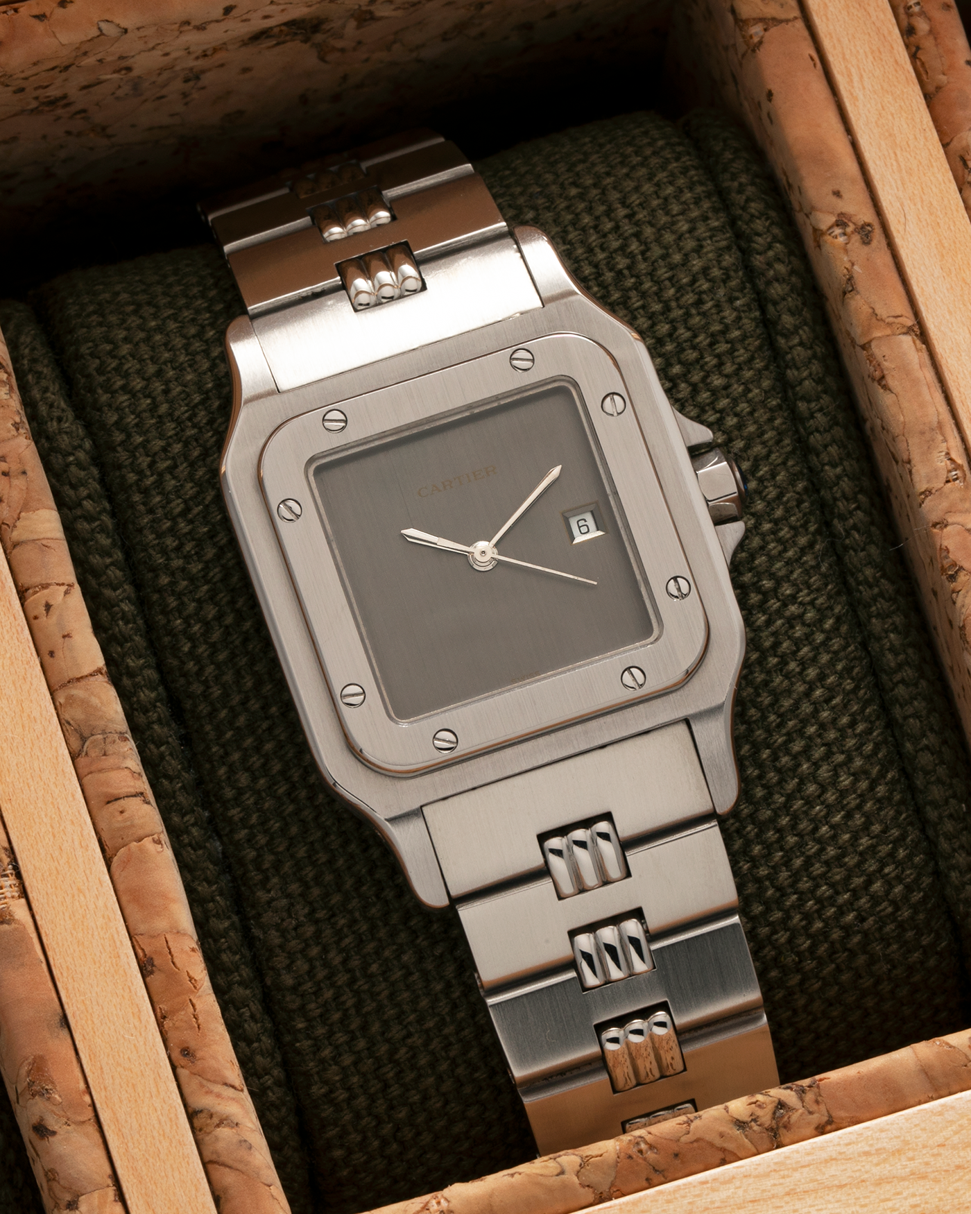 Brand: Cartier Year: 1980s Model: Santos ‘Carrée’ Reference: 2960 Material: Stainless Steel Movement: Cartier Cal. 077 (ETA Cal. 3671 Based), Self-Winding Case Dimensions: 29mm x 40.5mm Lug Width: 18mm Strap: Cartier Stainless Steel Godron ‘541811’ Bracelet with Signed Clasp