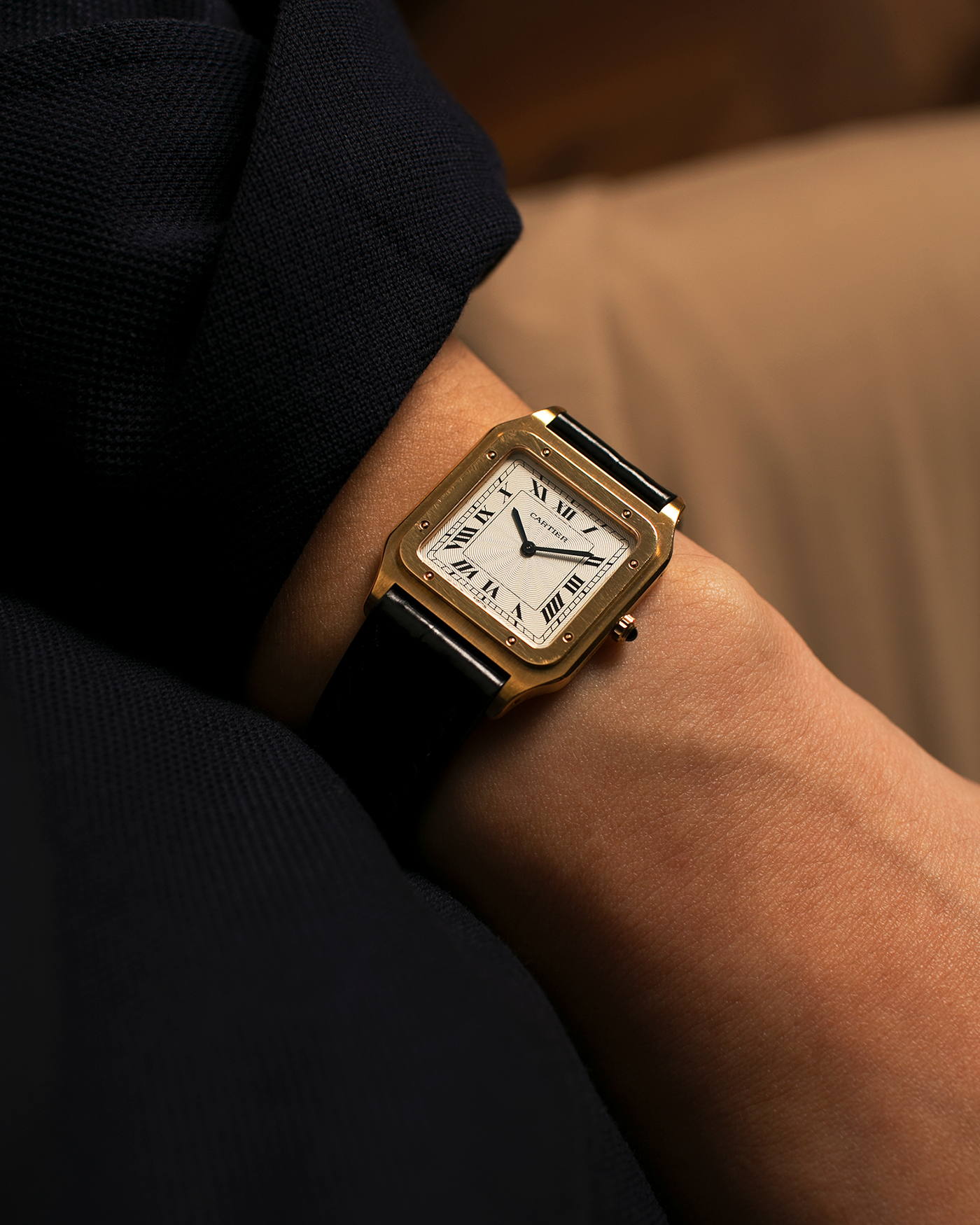 Brand: Cartier
Year: 1990s
Model: Santos Dumont
Reference: 1576
Material: 18-carat Yellow Gold
Movement: Cartier Cal. 021MC (Based on Frédéric Piguet 21 ébauche), Manual-Winding
Case Dimensions: 27mm x 6.5mm (Lug-to-Lug 36mm)
Lug Width: 17mm
Strap: Generic Unnamed Black Calf Leather Strap with Cartier Style Gold Plated Tang Buckle, Cartier Black Alligator Leather Strap