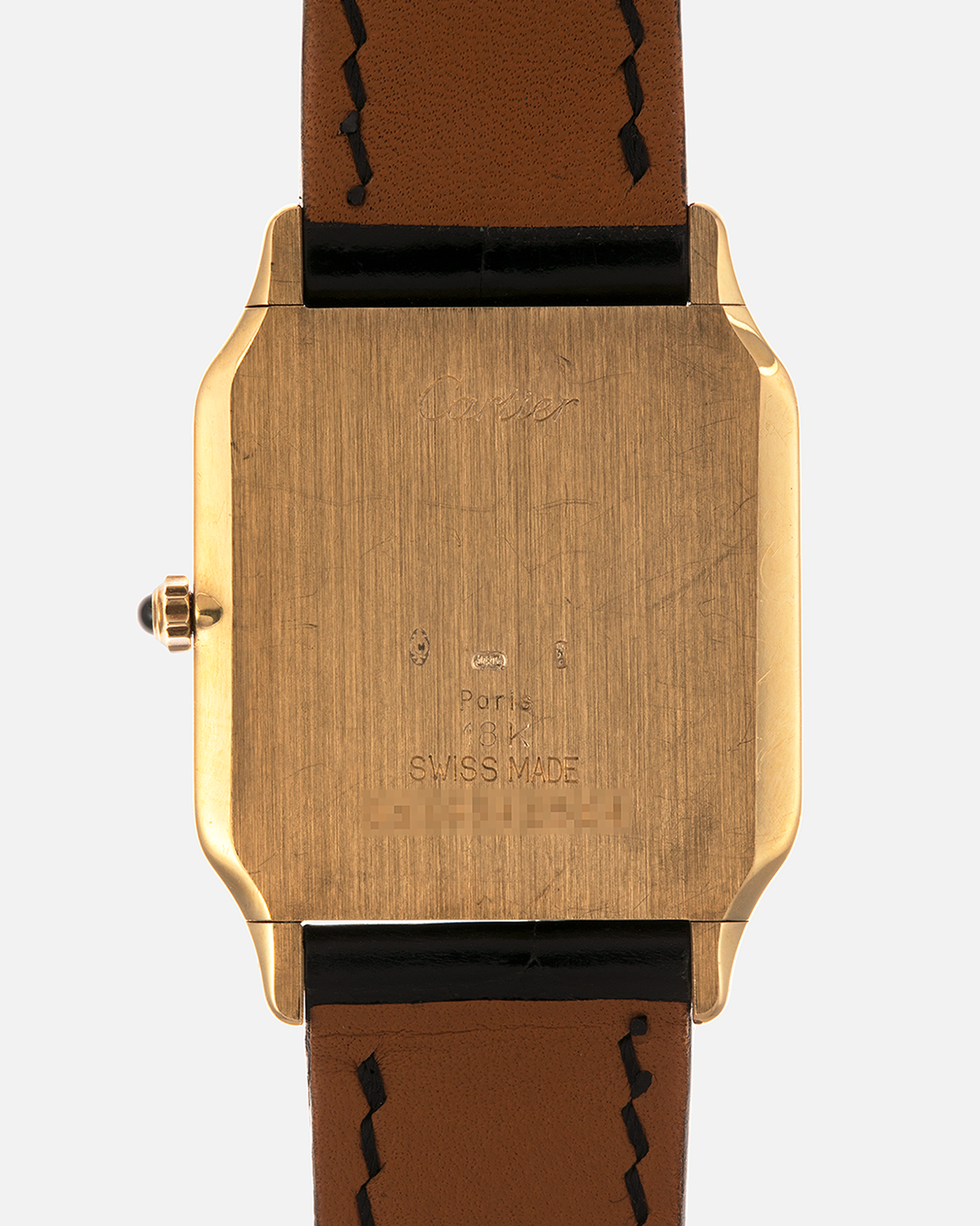 Brand: Cartier
Year: 1990s
Model: Santos Dumont
Reference: 1576
Material: 18-carat Yellow Gold
Movement: Cartier Cal. 021MC (Based on Frédéric Piguet 21 ébauche), Manual-Winding
Case Dimensions: 27mm x 6.5mm (Lug-to-Lug 36mm)
Lug Width: 17mm
Strap: Generic Unnamed Black Calf Leather Strap with Cartier Style Gold Plated Tang Buckle, Cartier Black Alligator Leather Strap