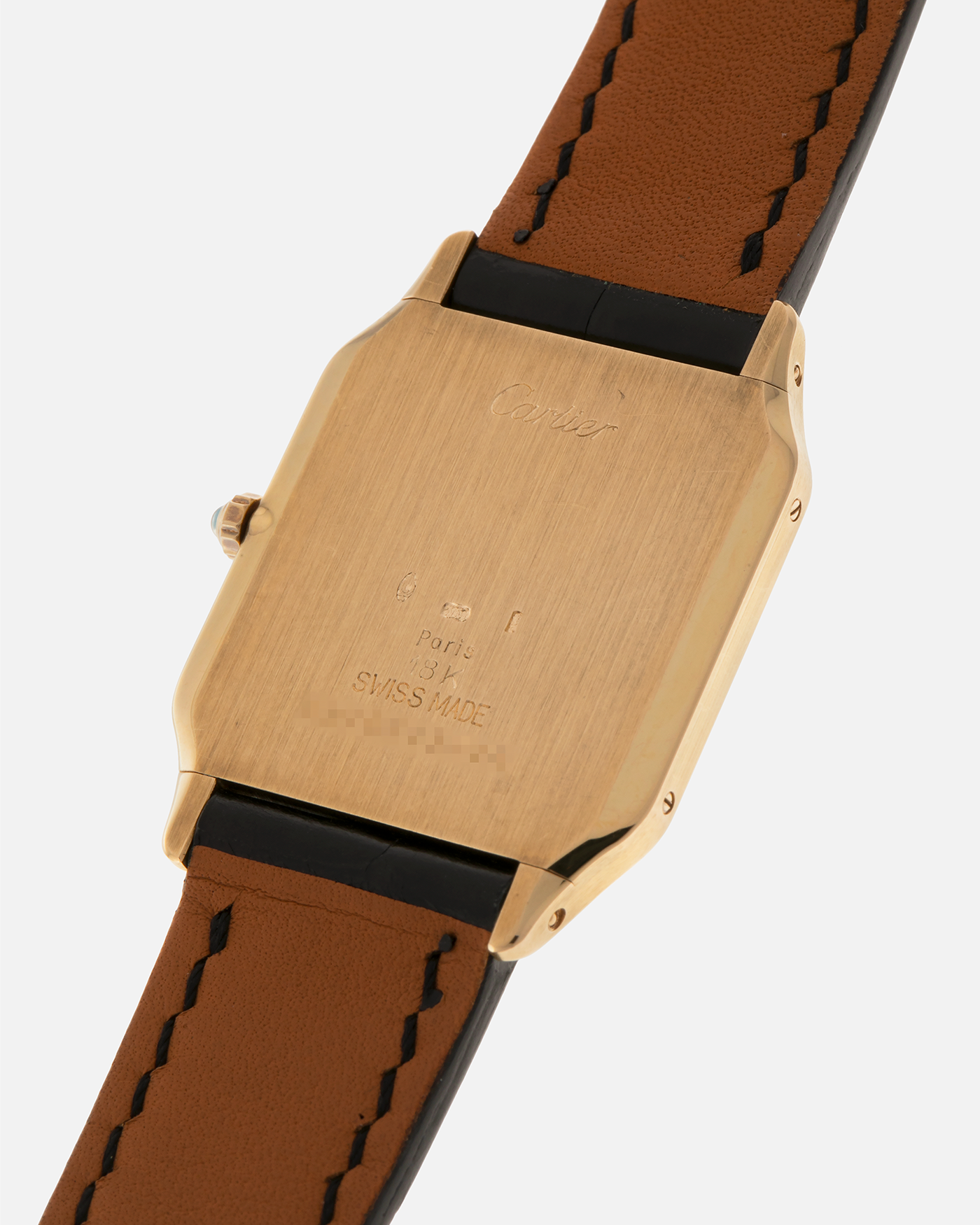Brand: Cartier
Year: 1990s
Model: Santos Dumont
Reference: 1576
Material: 18-carat Yellow Gold
Movement: Cartier Cal. 021MC (Based on Frédéric Piguet 21 ébauche), Manual-Winding
Case Dimensions: 27mm x 6.5mm (Lug-to-Lug 36mm)
Lug Width: 17mm
Strap: Generic Unnamed Black Calf Leather Strap with Cartier Style Gold Plated Tang Buckle, Cartier Black Alligator Leather Strap
