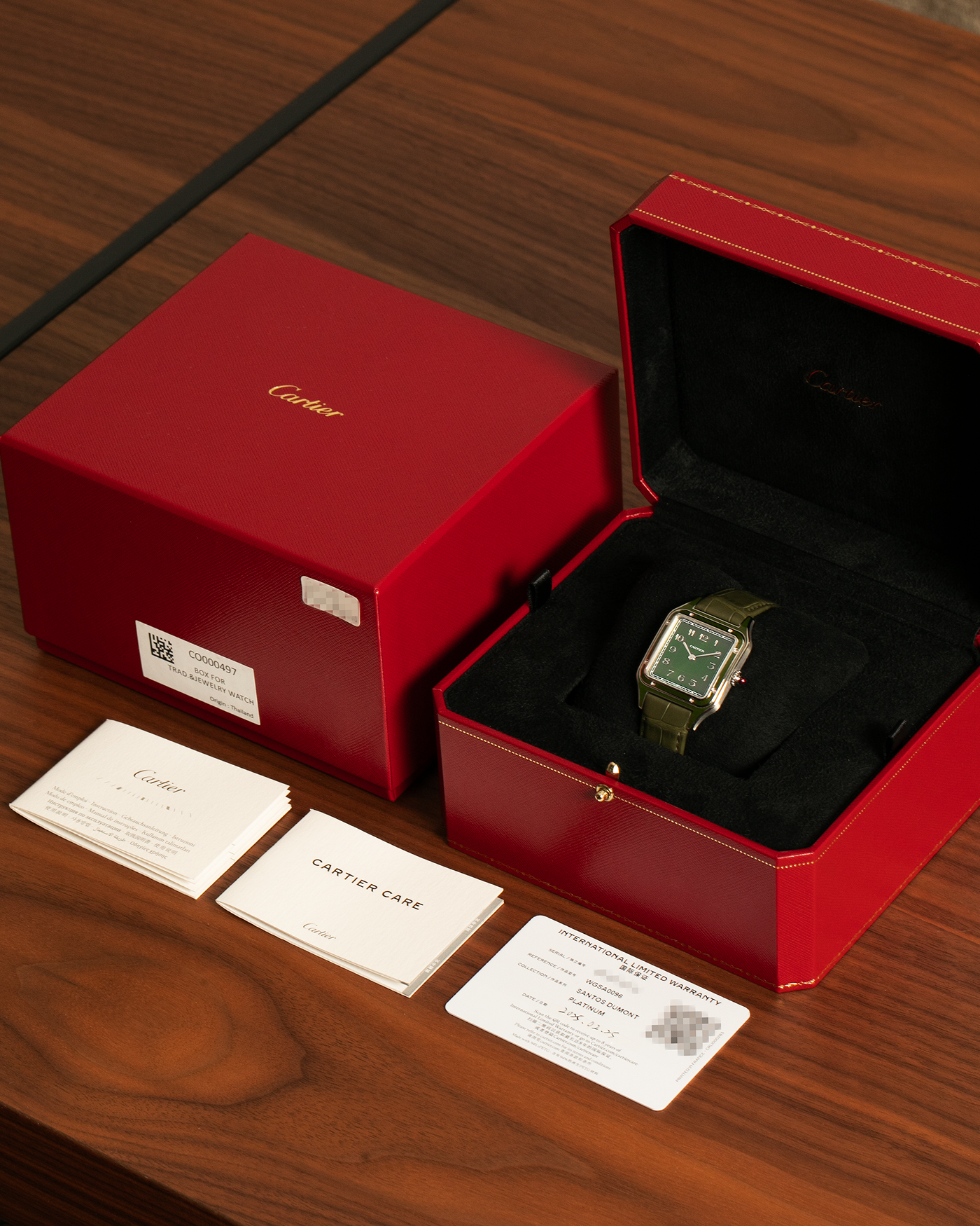 Brand: Cartier
Year: 2025
Model: Santos-Dumont Large, Limited Edition of 200 Pieces
Reference: WGSA0096
Material: Platinum 950, Green Lacquer
Movement: Cartier Cal. 430 MC, Manual-Winding
Case Dimensions: 43.5mm (Including Lugs) x 31.4mm
Strap: Cartier Olive Green  Alligator Leather Strap with Platinum Cartier Tang Buckle