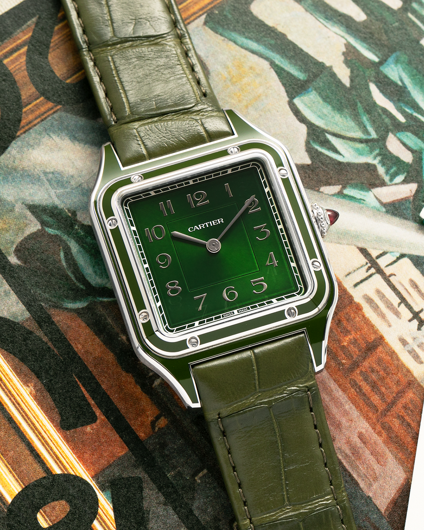 Brand: Cartier
Year: 2025
Model: Santos-Dumont Large, Limited Edition of 200 Pieces
Reference: WGSA0096
Material: Platinum 950, Green Lacquer
Movement: Cartier Cal. 430 MC, Manual-Winding
Case Dimensions: 43.5mm (Including Lugs) x 31.4mm
Strap: Cartier Olive Green  Alligator Leather Strap with Platinum Cartier Tang Buckle