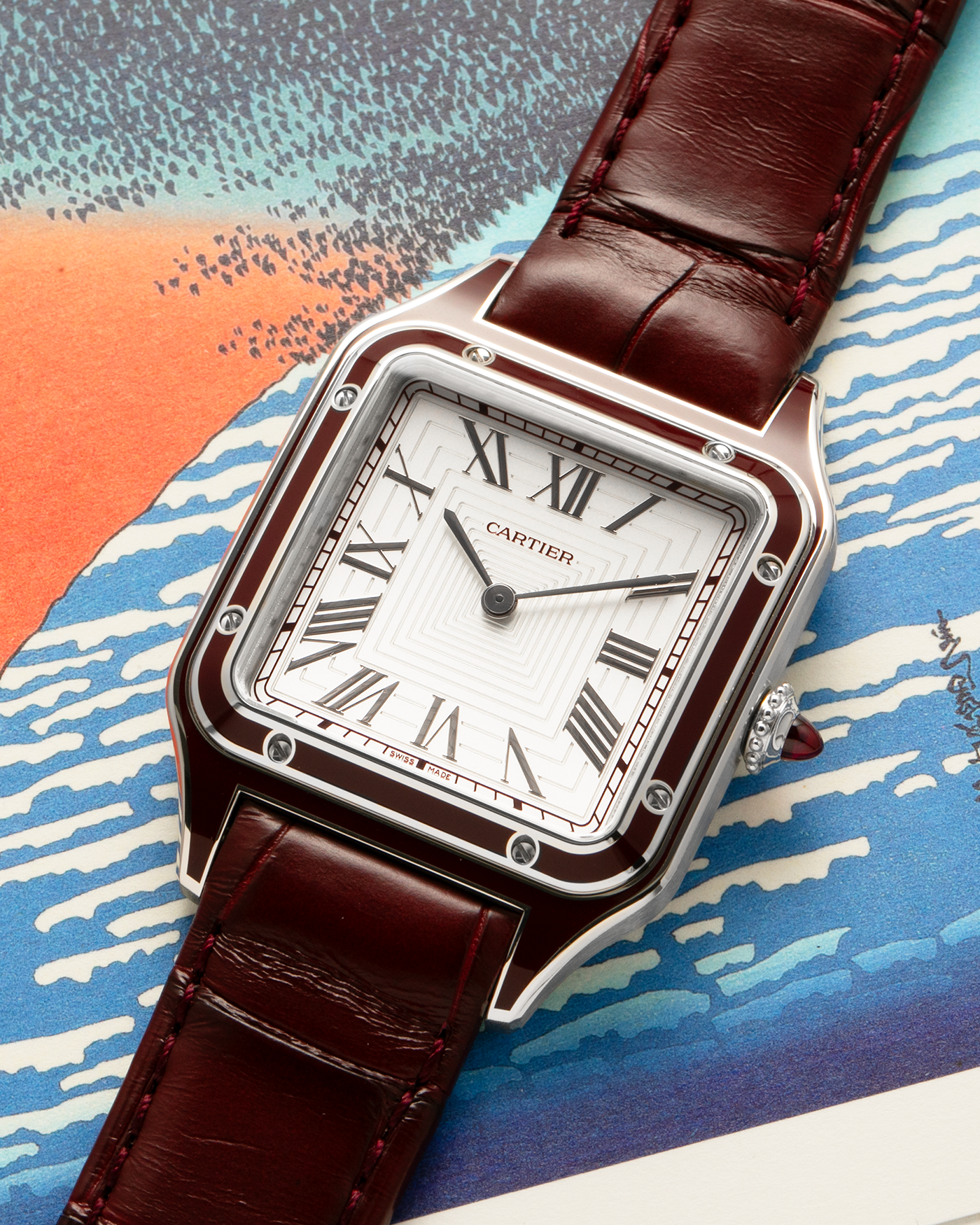 Brand: Cartier
Year: 2022
Model: Santos-Dumont Large, Limited Edition of 150 pieces in Platinum
Reference: WGSA0053
Material: Platinum 950, Burgundy Lacquer
Movement: Cartier Cal. 430 MC, Manual-Winding
Case Dimensions: 43.5mm (Including Lugs) x 31.4mm
Strap: Cartier Burgundy Alligator Leather Strap with Signed Platinum 950 Tang Buckle