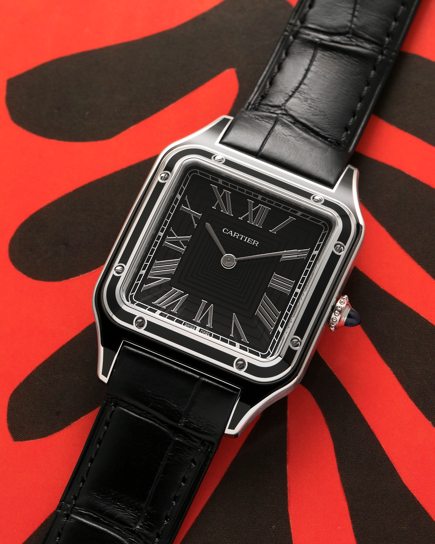 Brand: Cartier
Year: 2025
Model: Santos-Dumont Large ‘Lacquered’
Reference: CRWSSA0046
Material: Stainless Steel, Black Lacquer
Movement: Cartier Cal. 430 MC, Manual-Winding
Case Dimensions: 43.5mm (Including Lugs) x 31.4mm
Strap: Cartier Black Alligator Leather Strap with Signed Stainless Steel Tang Buckle