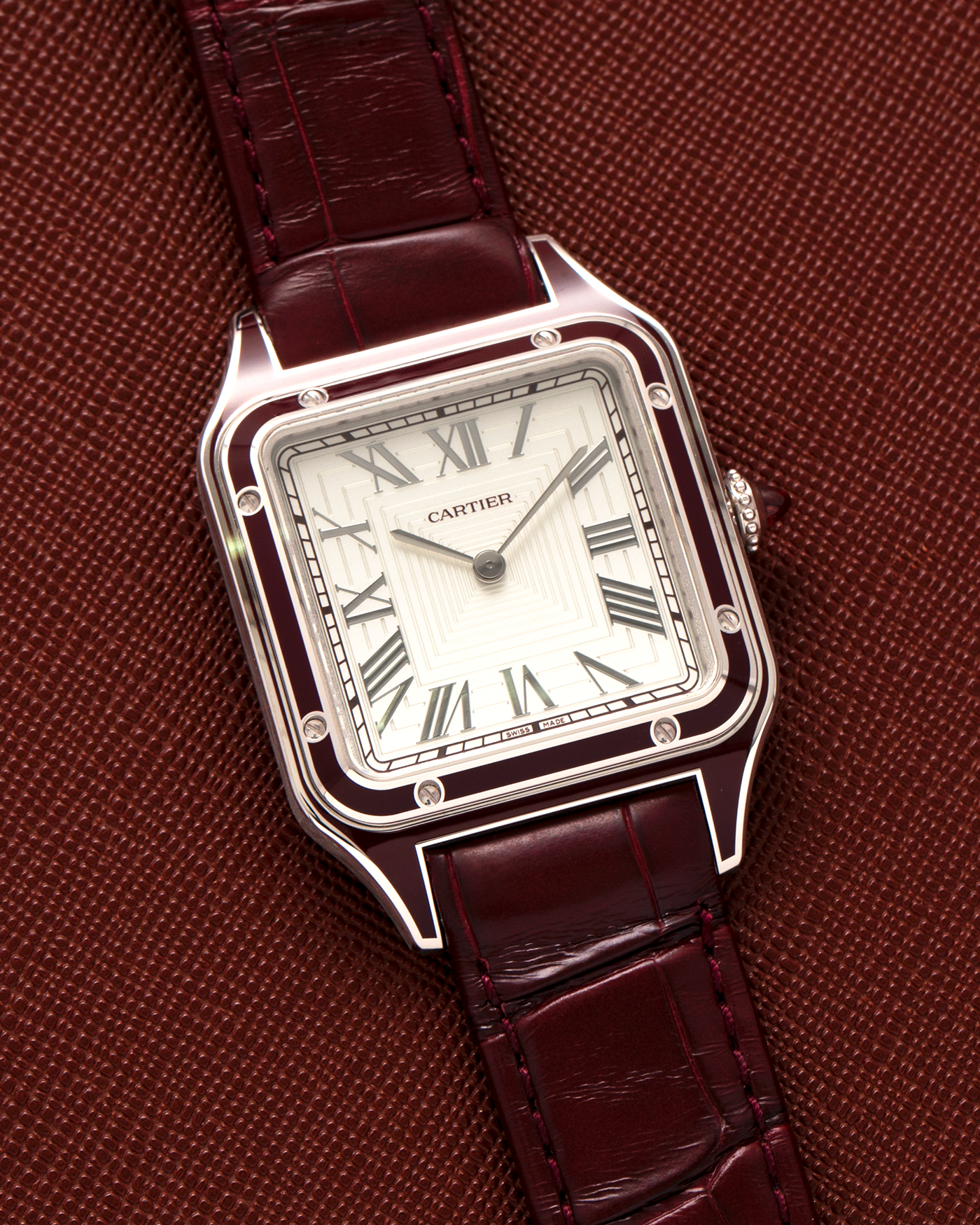 Brand: Cartier
Year: 2022
Model: Santos-Dumont Large, Limited Edition of 150 pieces
Material: Platinum 950, Burgundy Lacquer
Movement: Cartier Cal. 430 MC, Manual-Winding
Case Dimensions: 43.5mm (Including Lugs) x 31.4mm
Strap: Cartier Burgundy Alligator Leather Strap with Signed Platinum 950 Tang Buckle