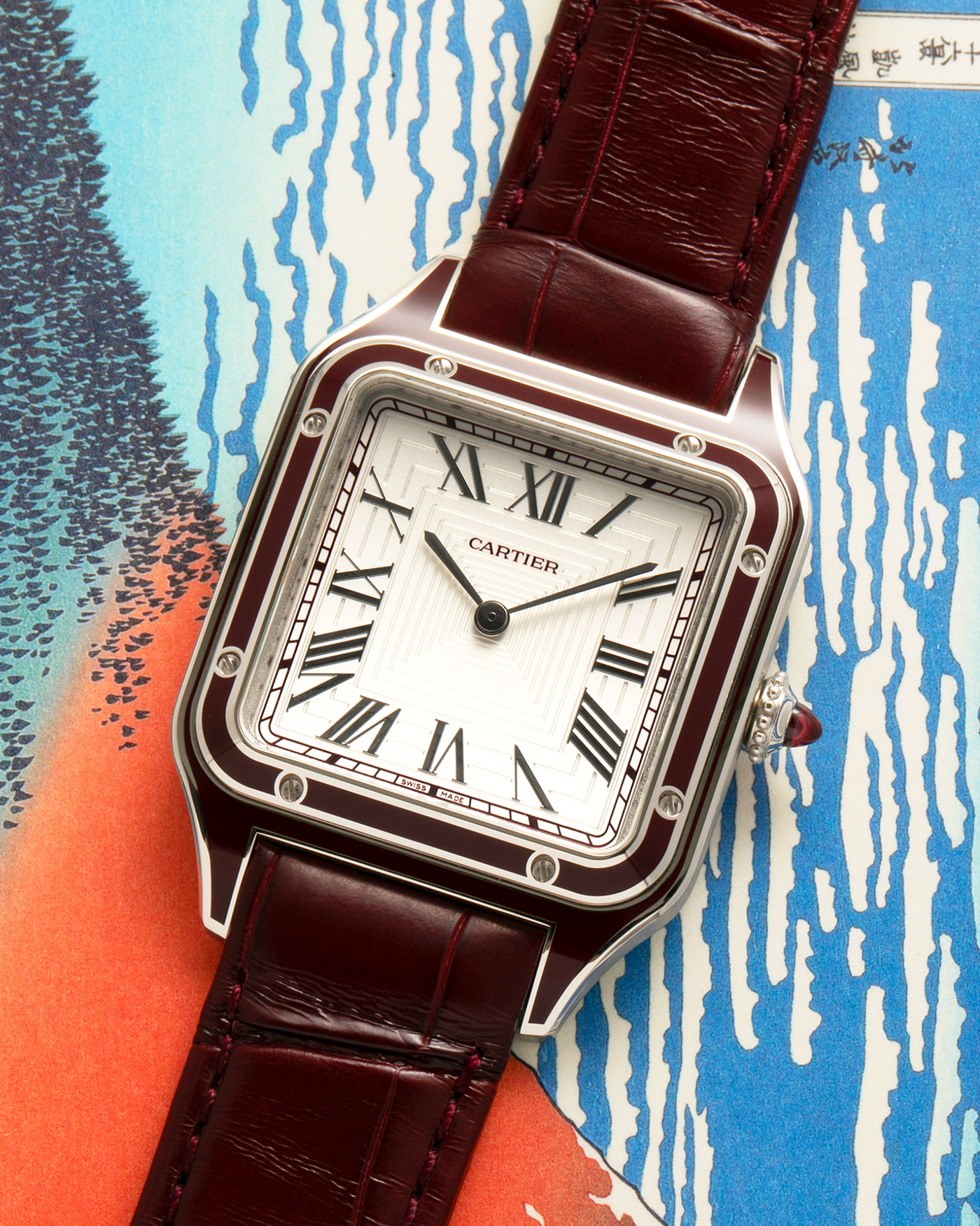 Brand: Cartier
Year: 2022
Model: Santos-Dumont Large, Limited Edition of 150 pieces
Material: Platinum 950, Burgundy Lacquer
Movement: Cartier Cal. 430 MC, Manual-Winding
Case Dimensions: 43.5mm (Including Lugs) x 31.4mm
Strap: Cartier Burgundy Alligator Leather Strap with Signed Platinum 950 Tang Buckle