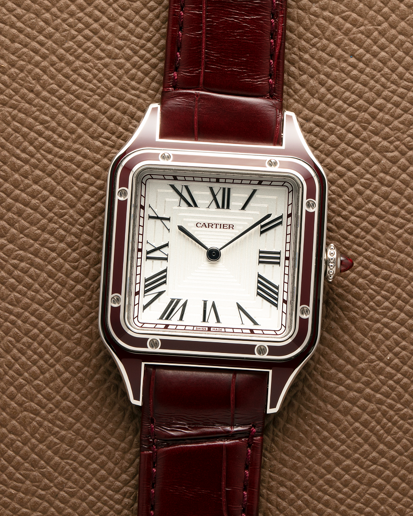 Brand: Cartier
Year: 2022
Model: Santos-Dumont Large, Limited Edition of 150 pieces
Material: Platinum 950, Burgundy Lacquer
Movement: Cartier Cal. 430 MC, Manual-Winding
Case Dimensions: 43.5mm (Including Lugs) x 31.4mm
Strap: Cartier Burgundy Alligator Leather Strap with Signed Platinum 950 Tang Buckle