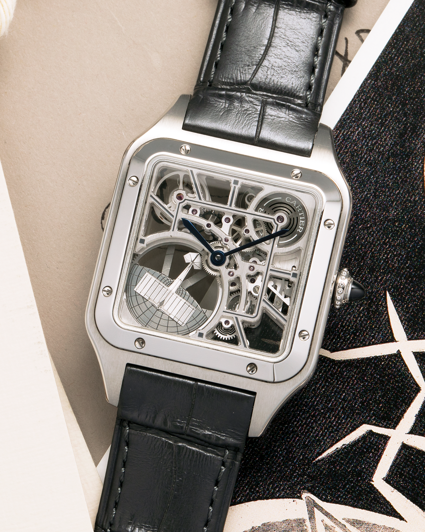 Brand: Cartier
Year: 2023
Model: Santos Dumont Skeleton Micro-Rotor
Reference: CRWHSA0032
Material: Stainless Steel
Movement: Cartier Cal. 9629 MC, Self-Winding Micro-Rotor
Case Dimensions: 31.4mm x 43.5mm (Including Lugs)
Strap: Cartier Dark Navy Alligator Leather Strap with Signed Stainless Steel Tang Buckle
